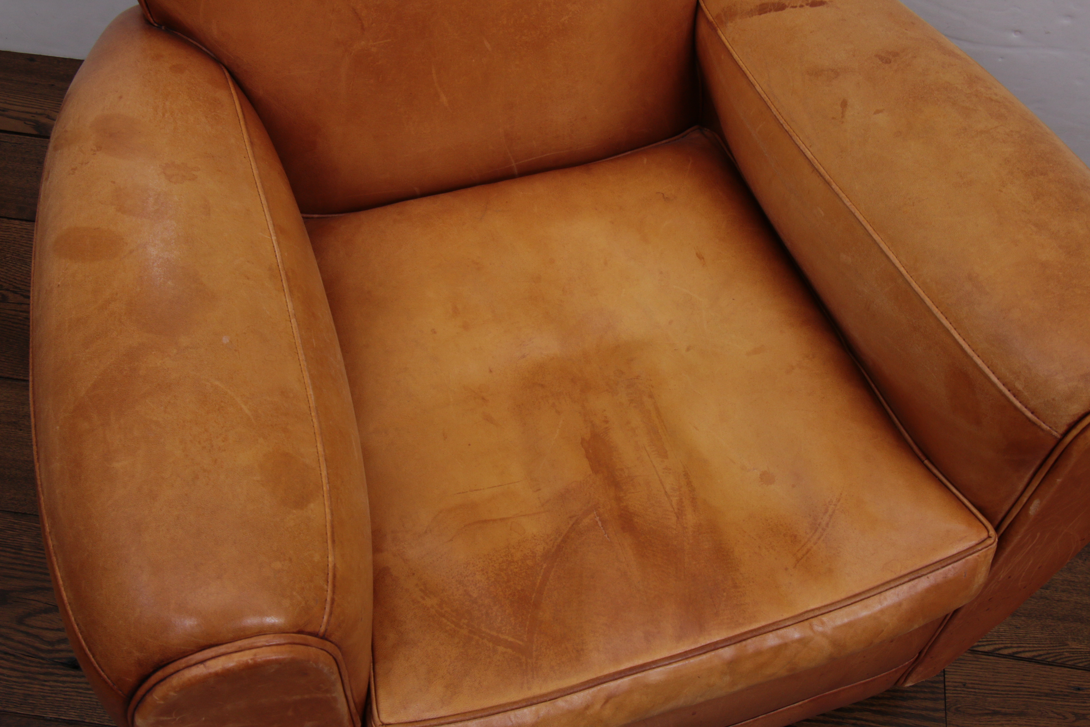 Distressed Leather Armchairs with Nailhead Trim by Centners Design