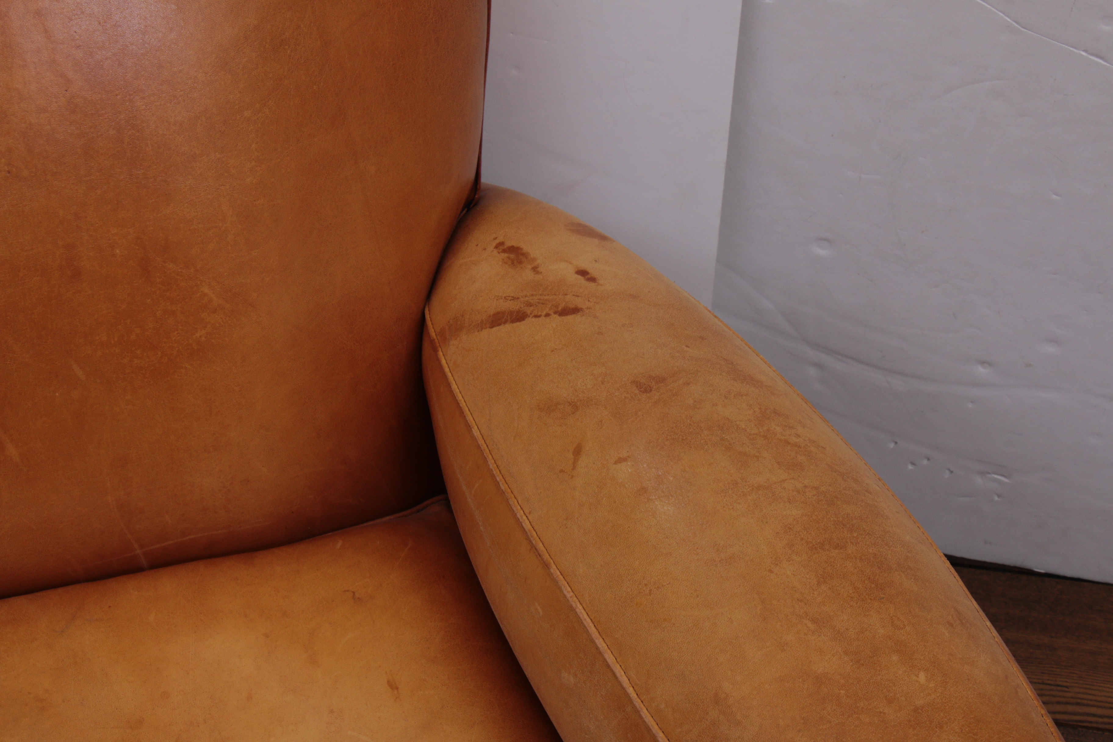 Distressed Leather Armchairs with Nailhead Trim by Centners Design