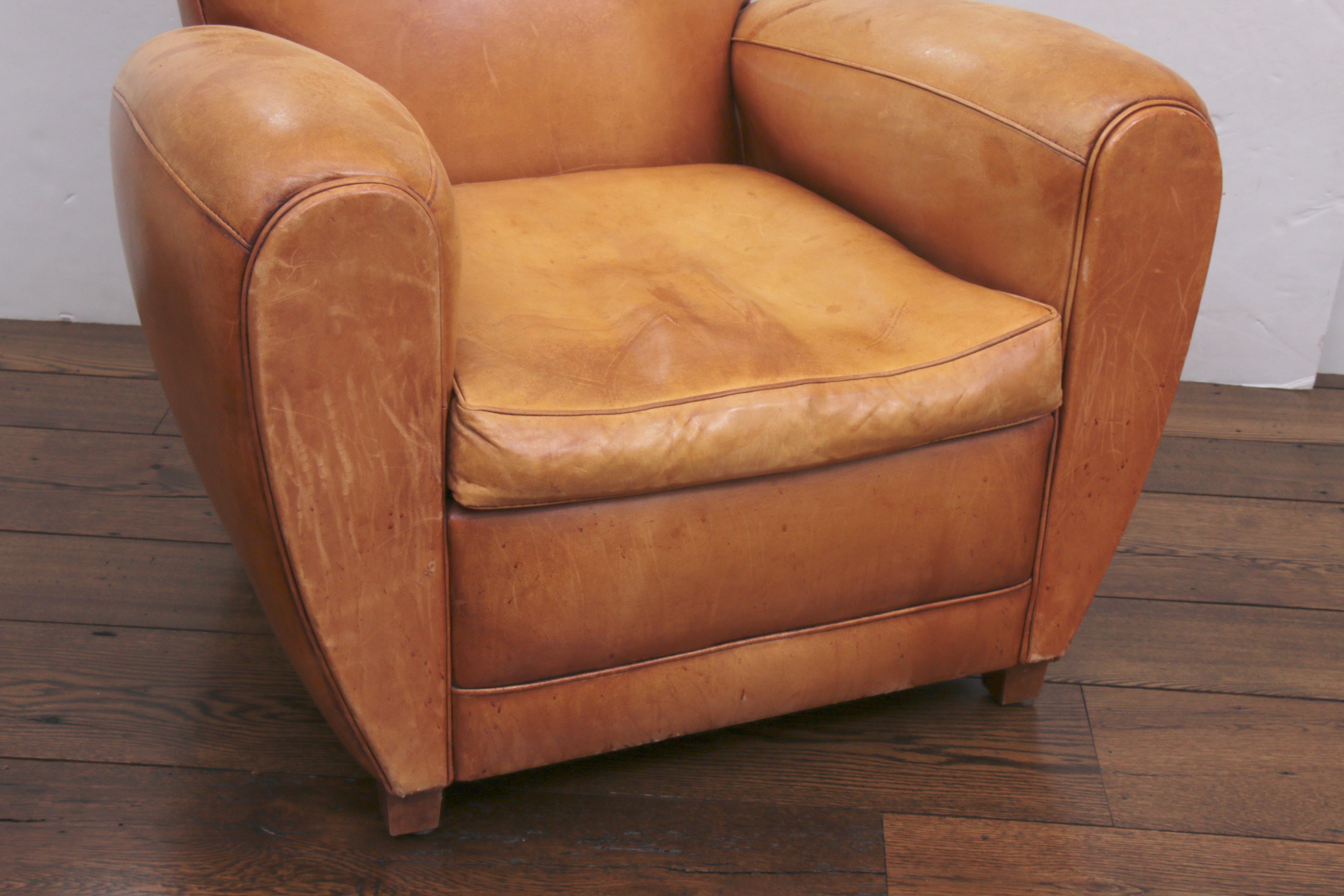Distressed Leather Armchairs with Nailhead Trim by Centners Design