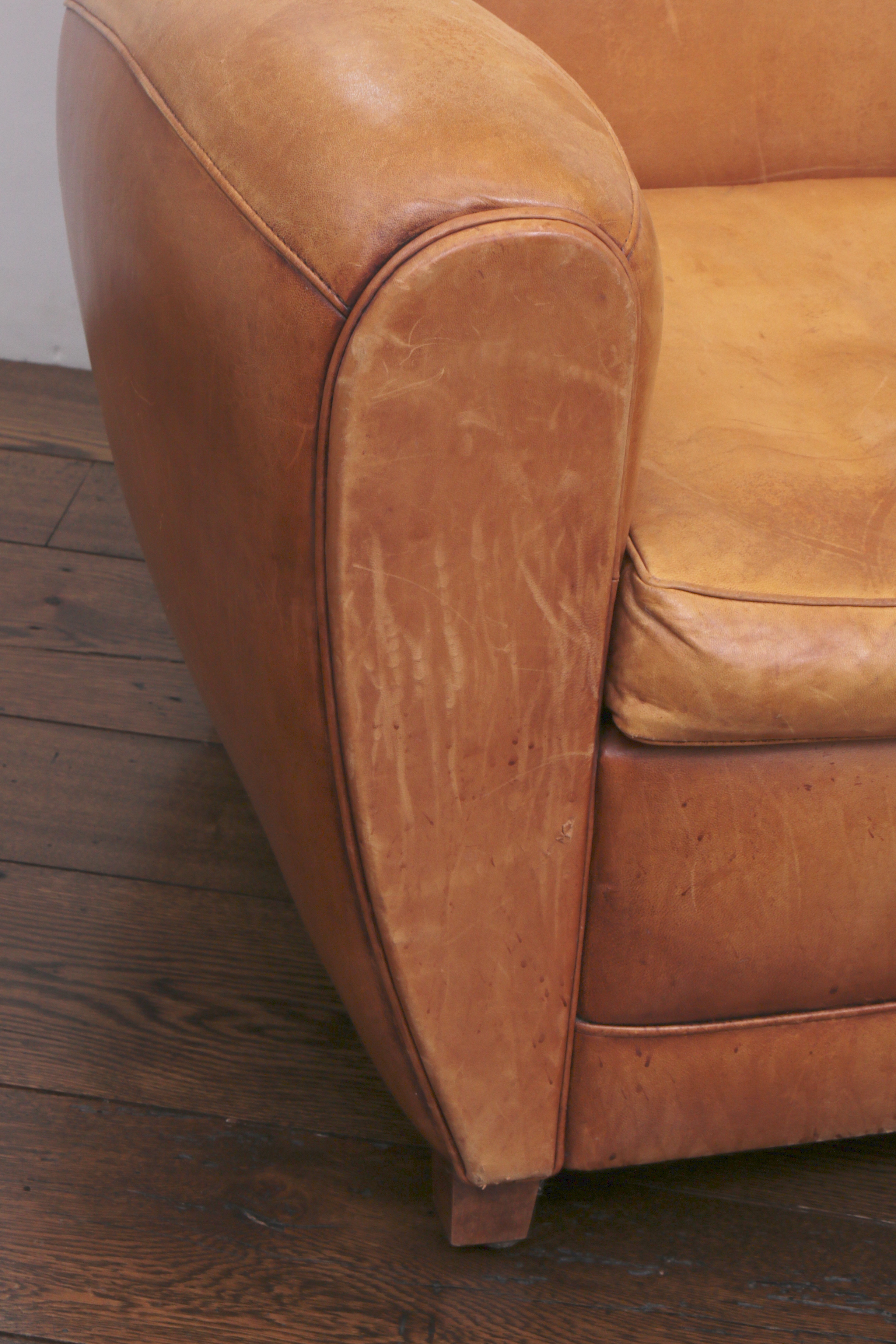 Distressed Leather Armchairs with Nailhead Trim by Centners Design