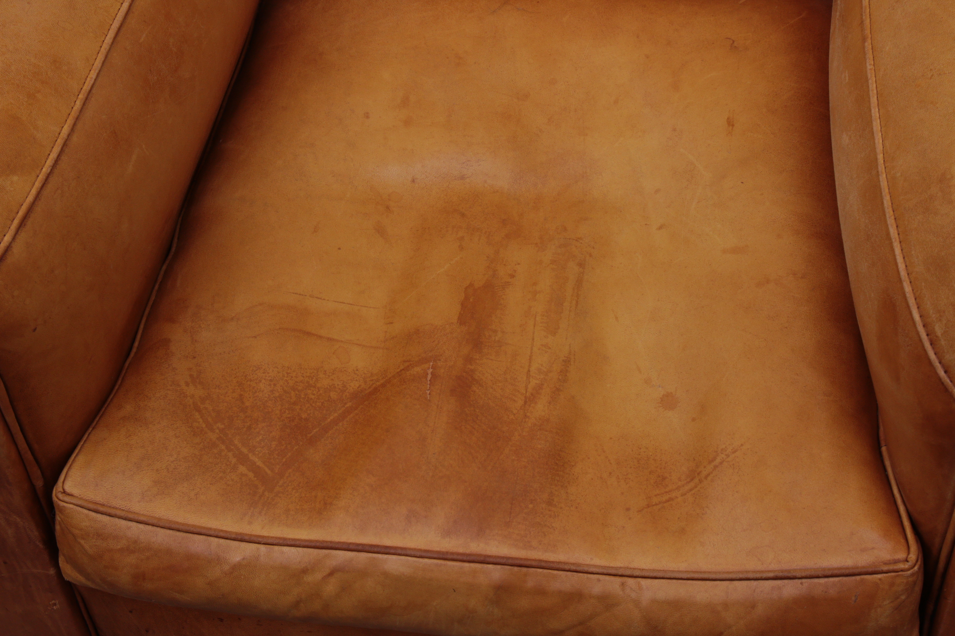 Distressed Leather Armchairs with Nailhead Trim by Centners Design