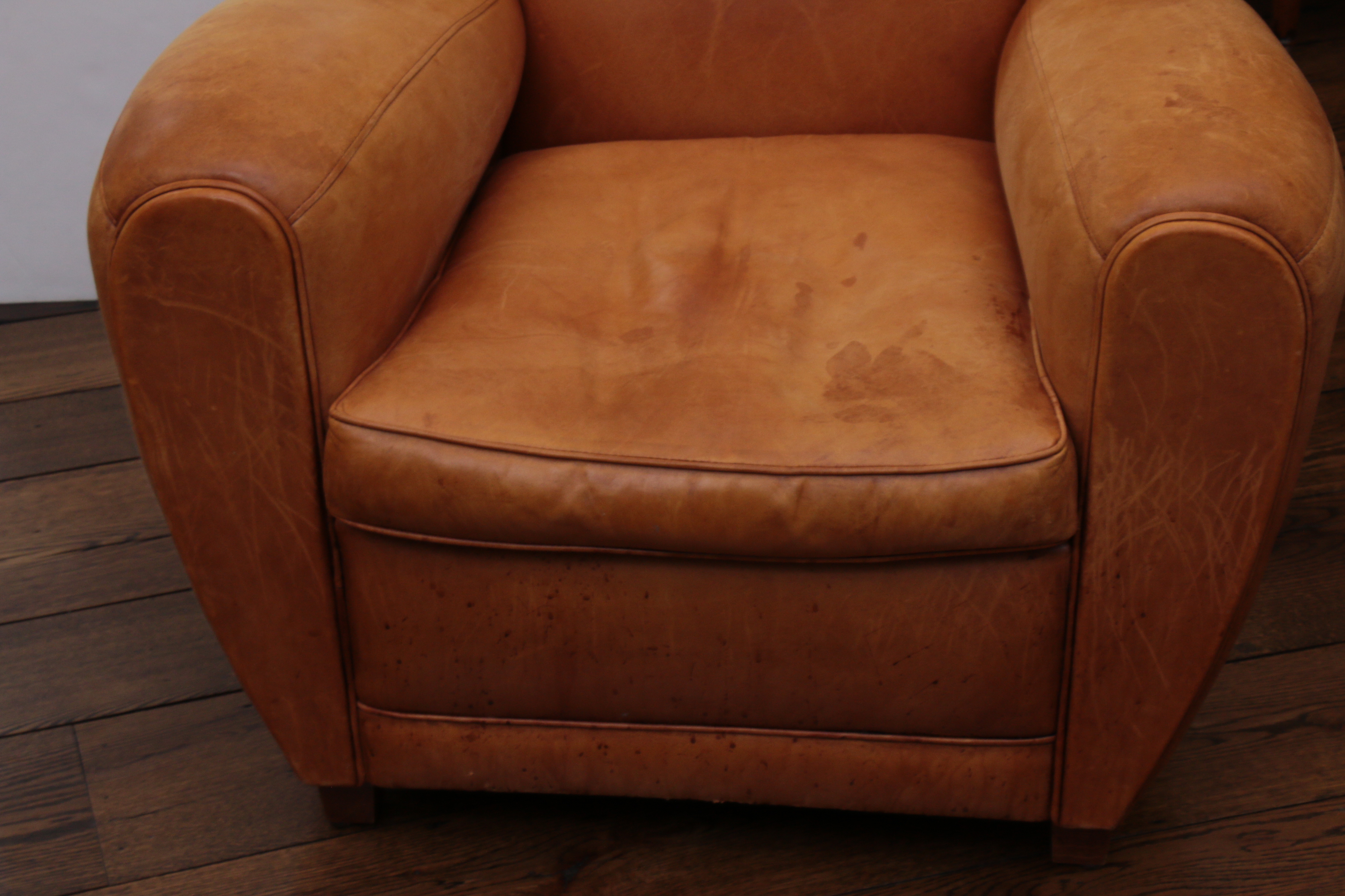 Distressed Leather Armchairs with Nailhead Trim by Centners Design
