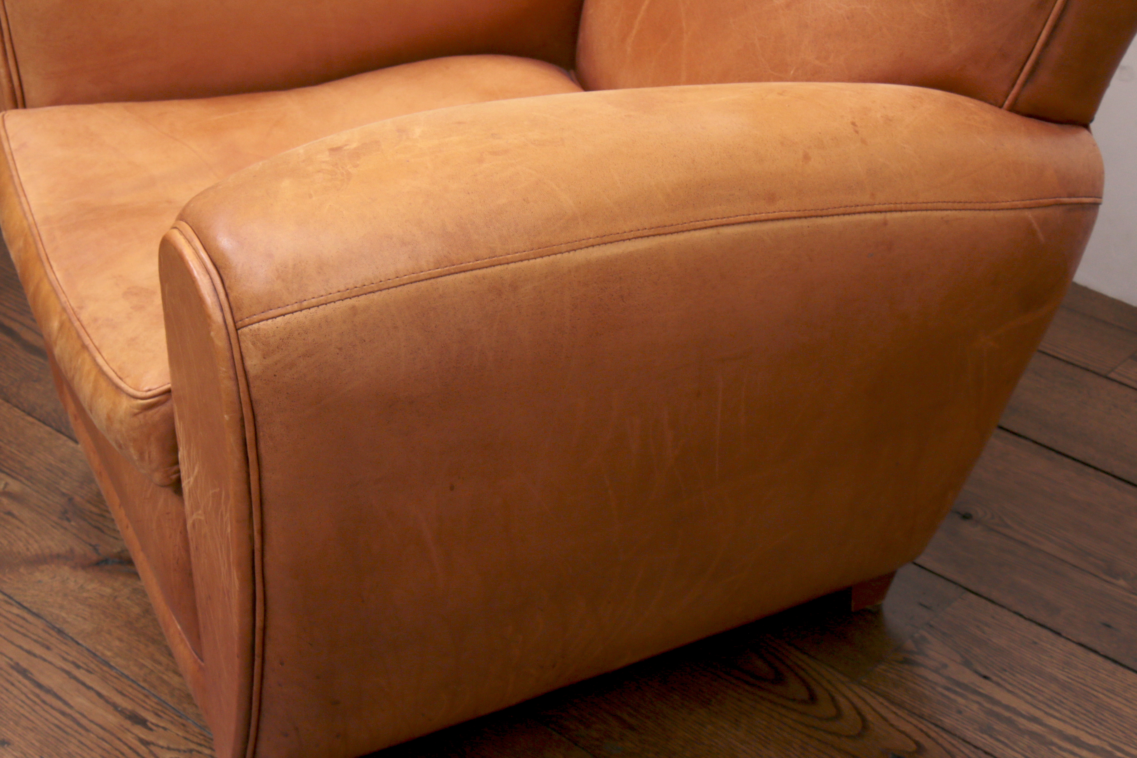 Distressed Leather Armchairs with Nailhead Trim by Centners Design