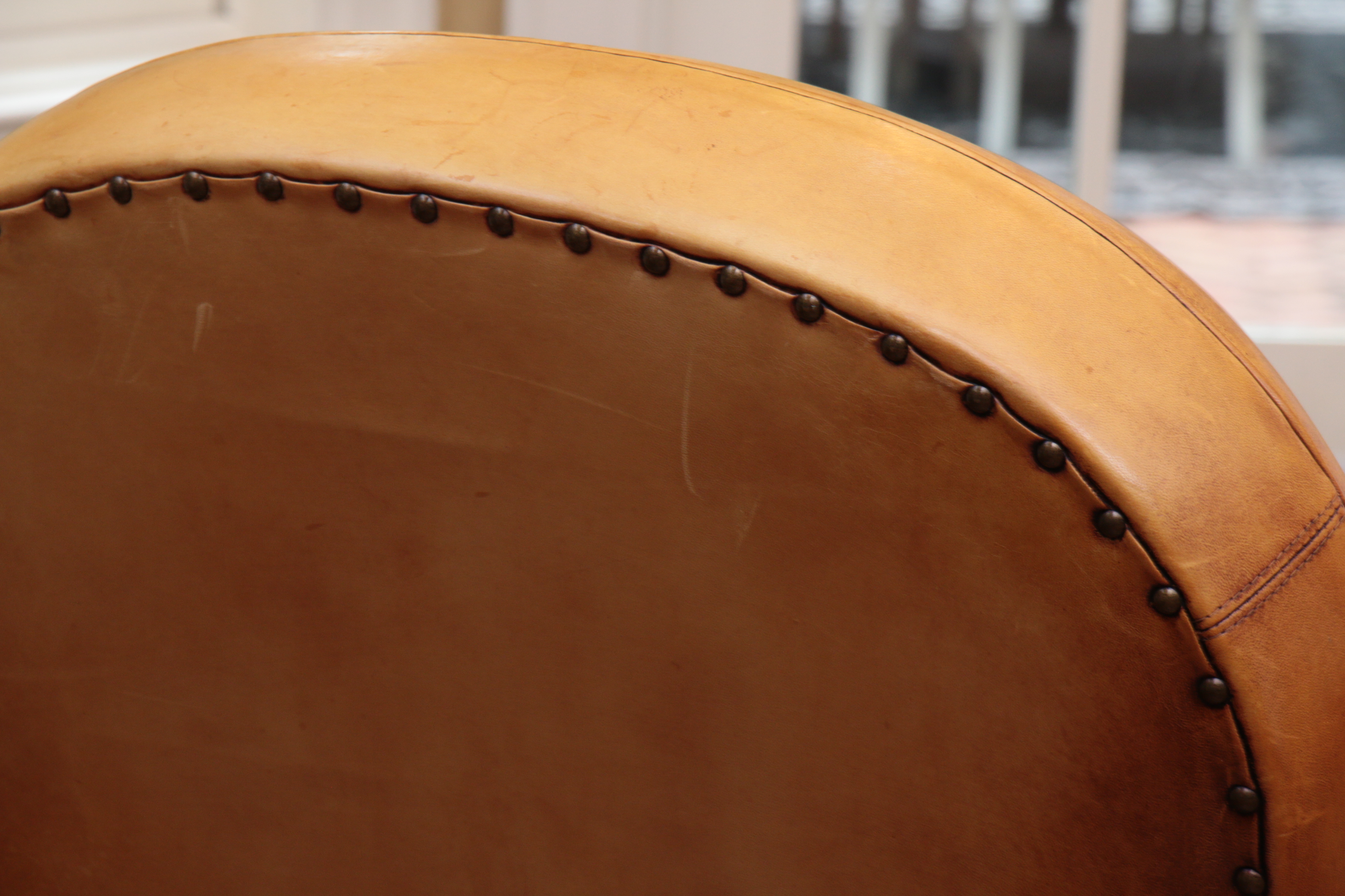 Distressed Leather Armchairs with Nailhead Trim by Centners Design