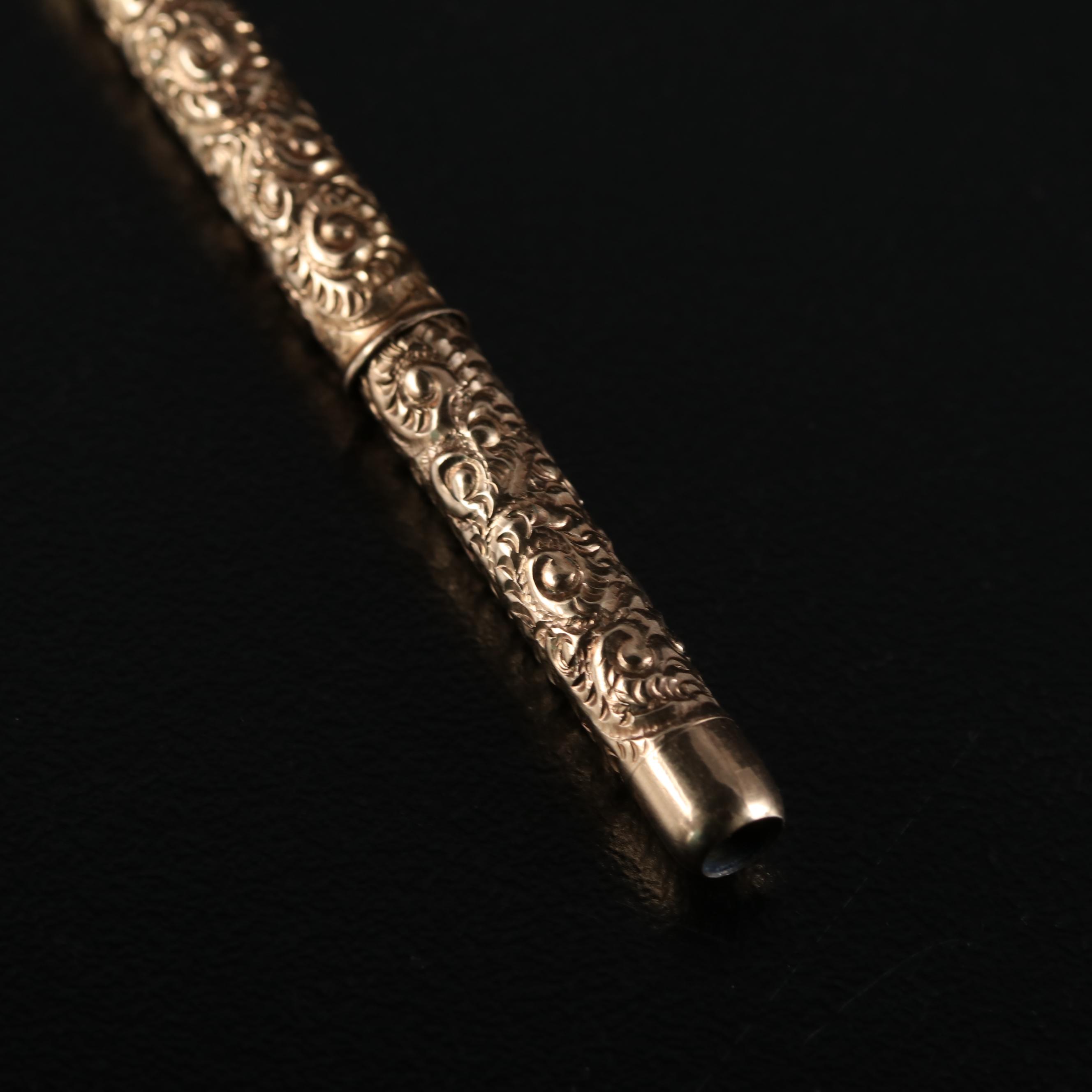 Late Victorian Fairchild Gold Tone Chased Metal Retractable Toothpick