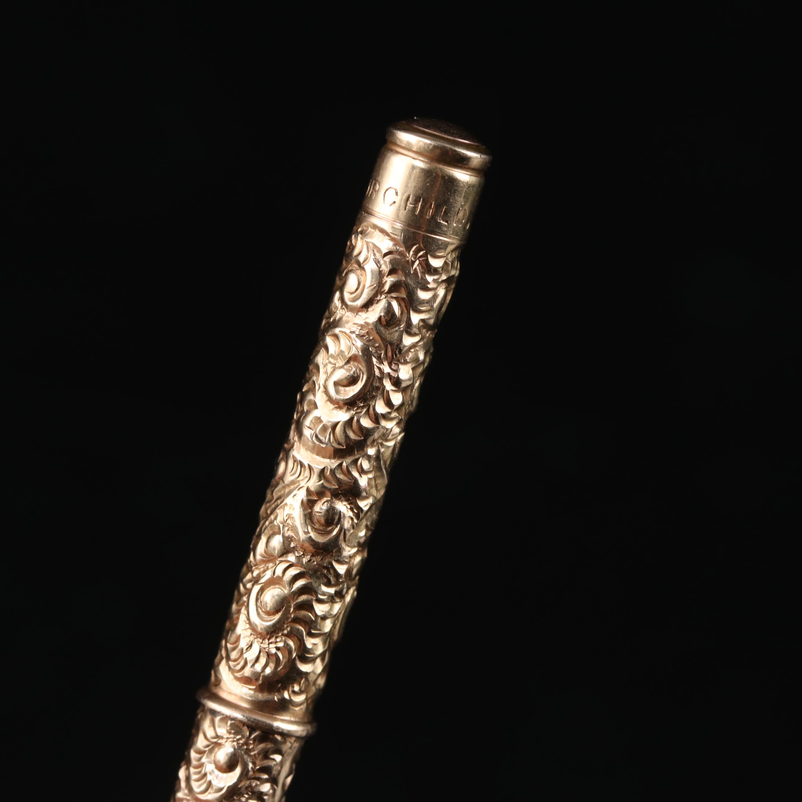Late Victorian Fairchild Gold Tone Chased Metal Retractable Toothpick