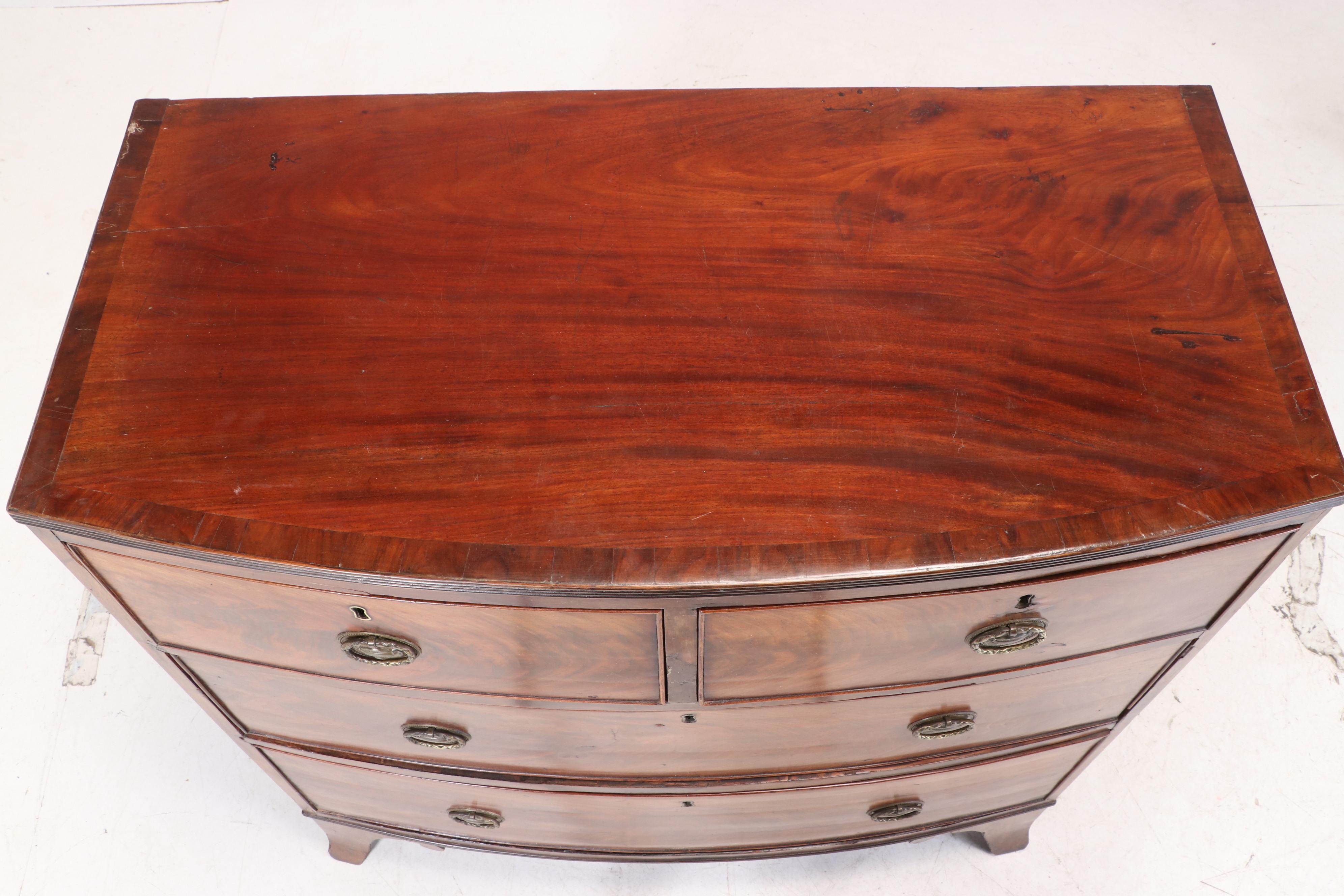 George III Flame Mahogany and Crossbanded Four-Drawer Bowfront Chest, circa 1800