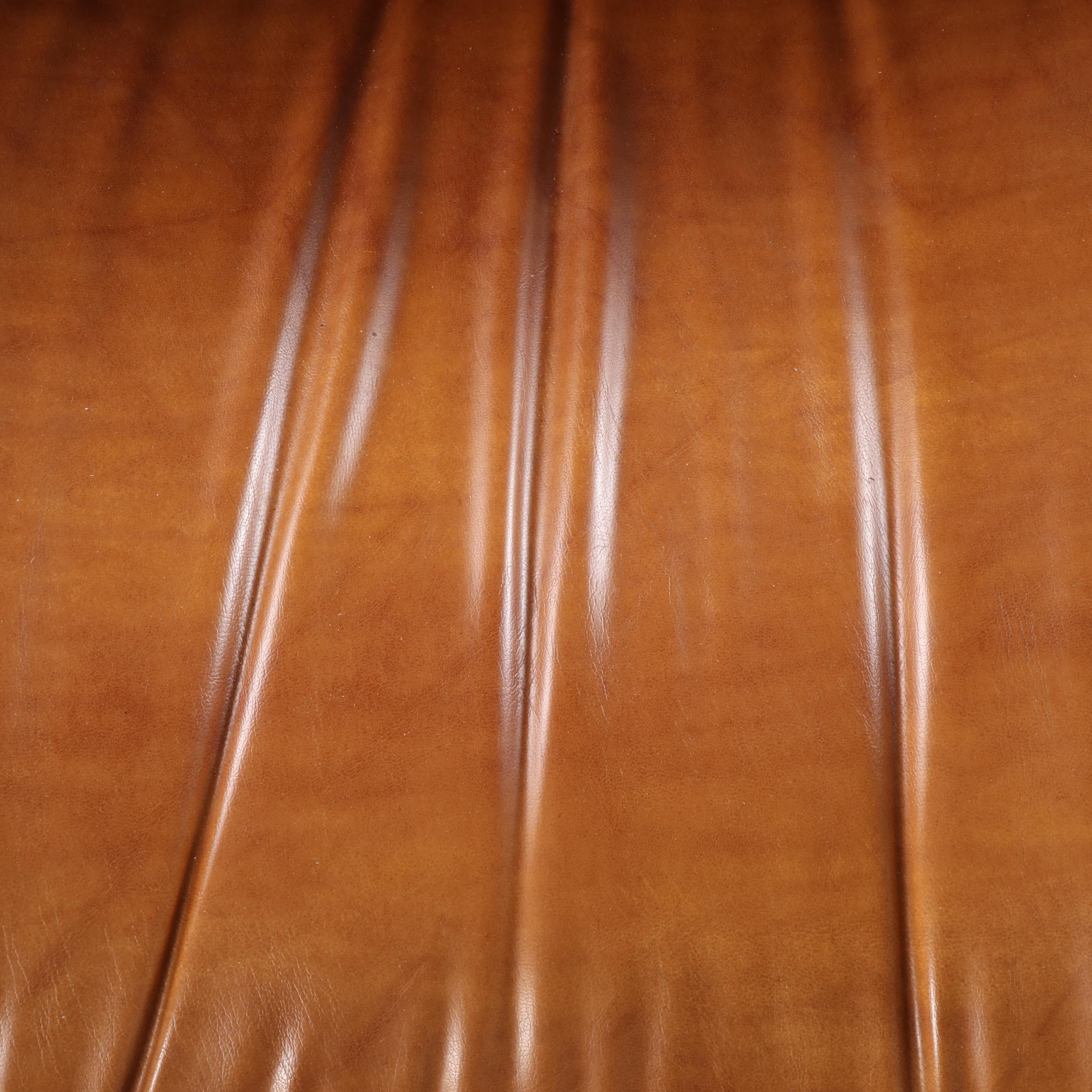 Eames Style Laminated Wood and Cognac Leather Lounge Chair and Ottoman, 20th C.