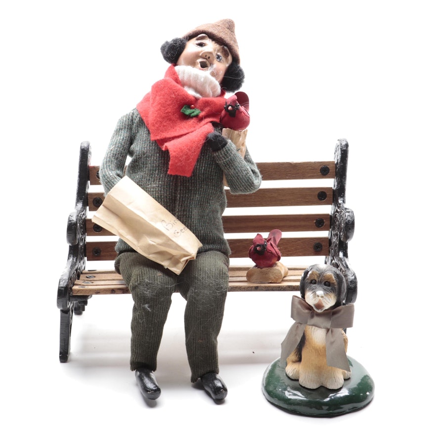 Byers' Choice Ltd. A Man on a Bench and Dog Carolers, Late 20th Century
