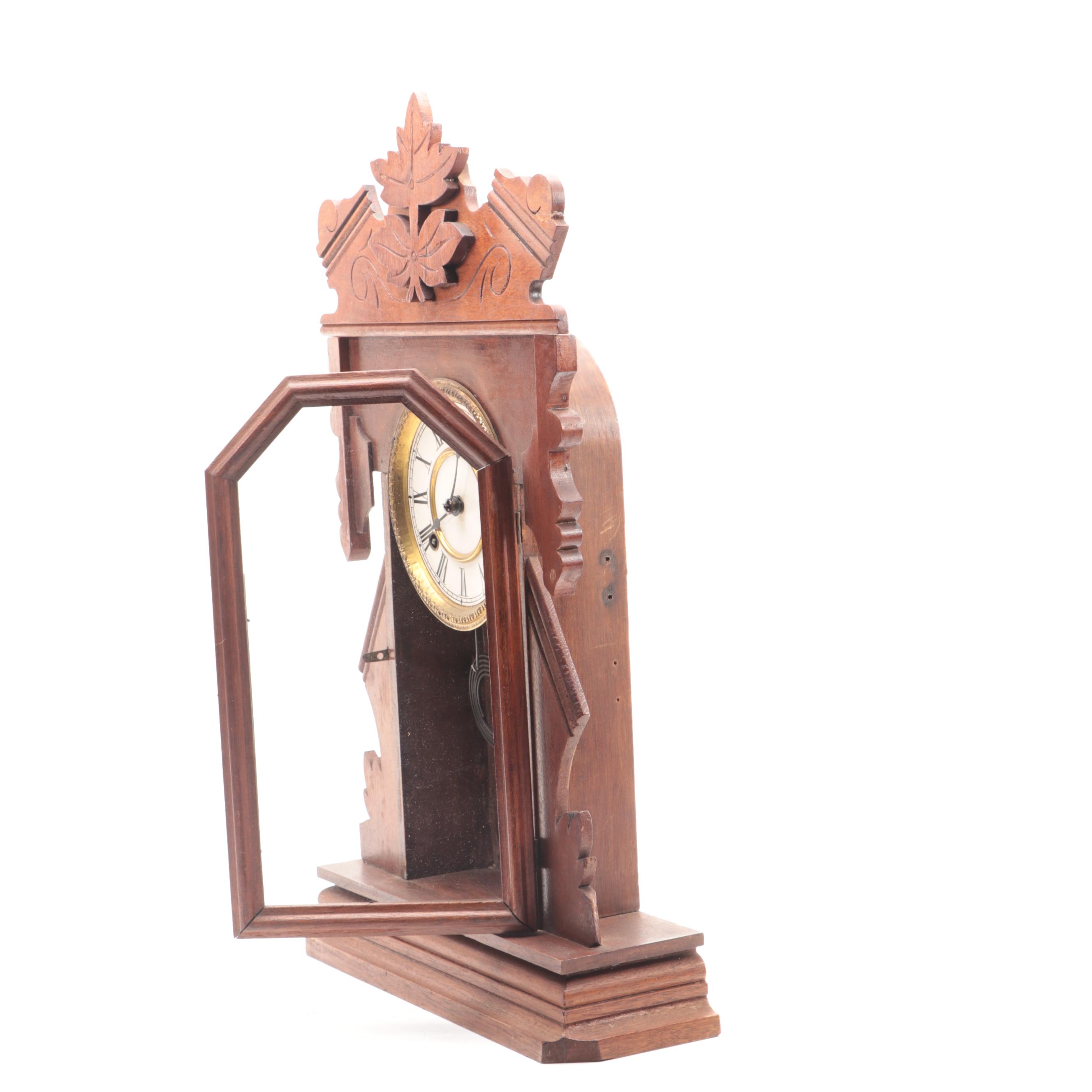 New Haven Clock Co Walnut Gingerbread Clock, Late 19th to Early 20th Century