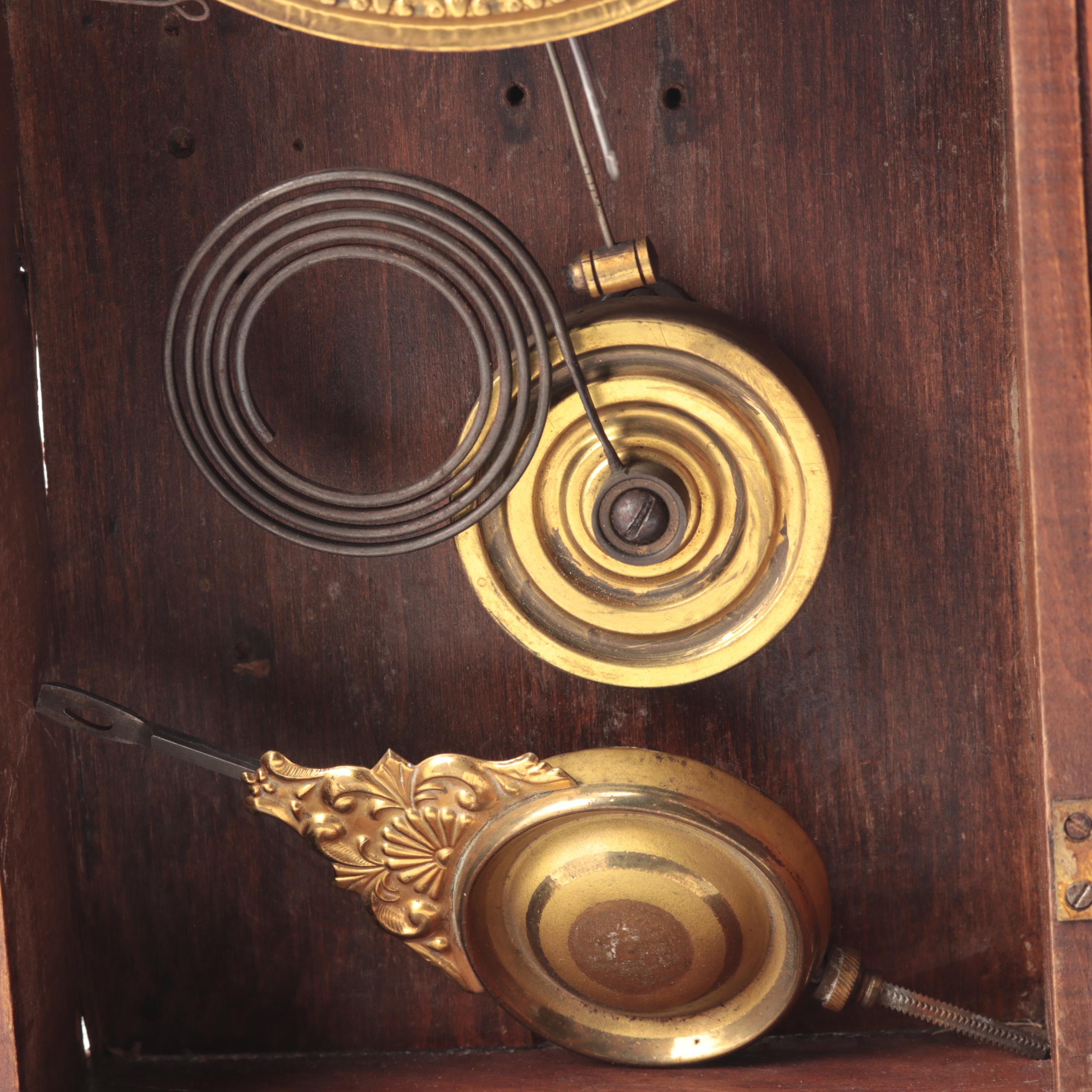 New Haven Clock Co Walnut Gingerbread Clock, Late 19th to Early 20th Century