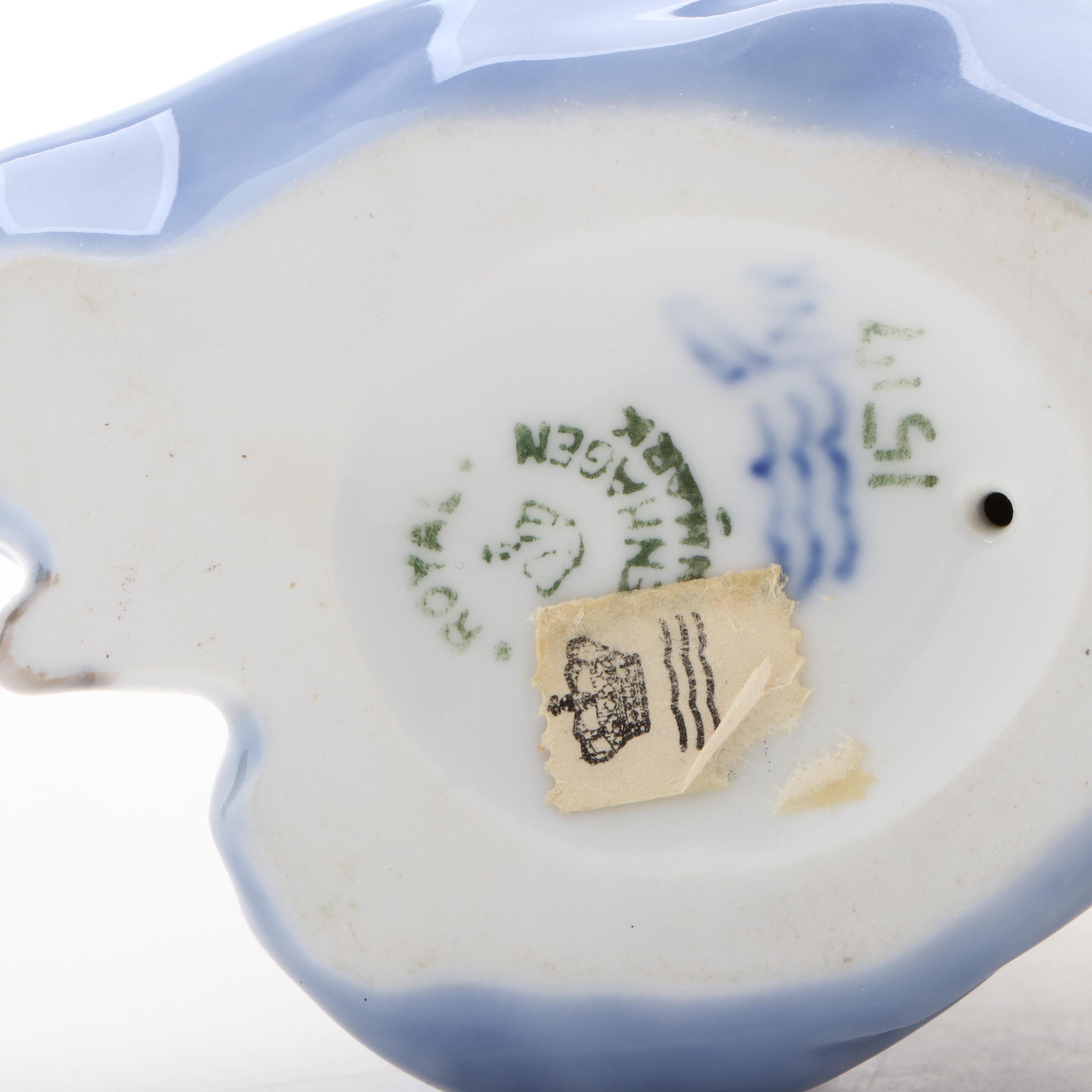 Royal Copenhagen "Baby Crawling" and "Baby Pointing" Porcelain Figurines