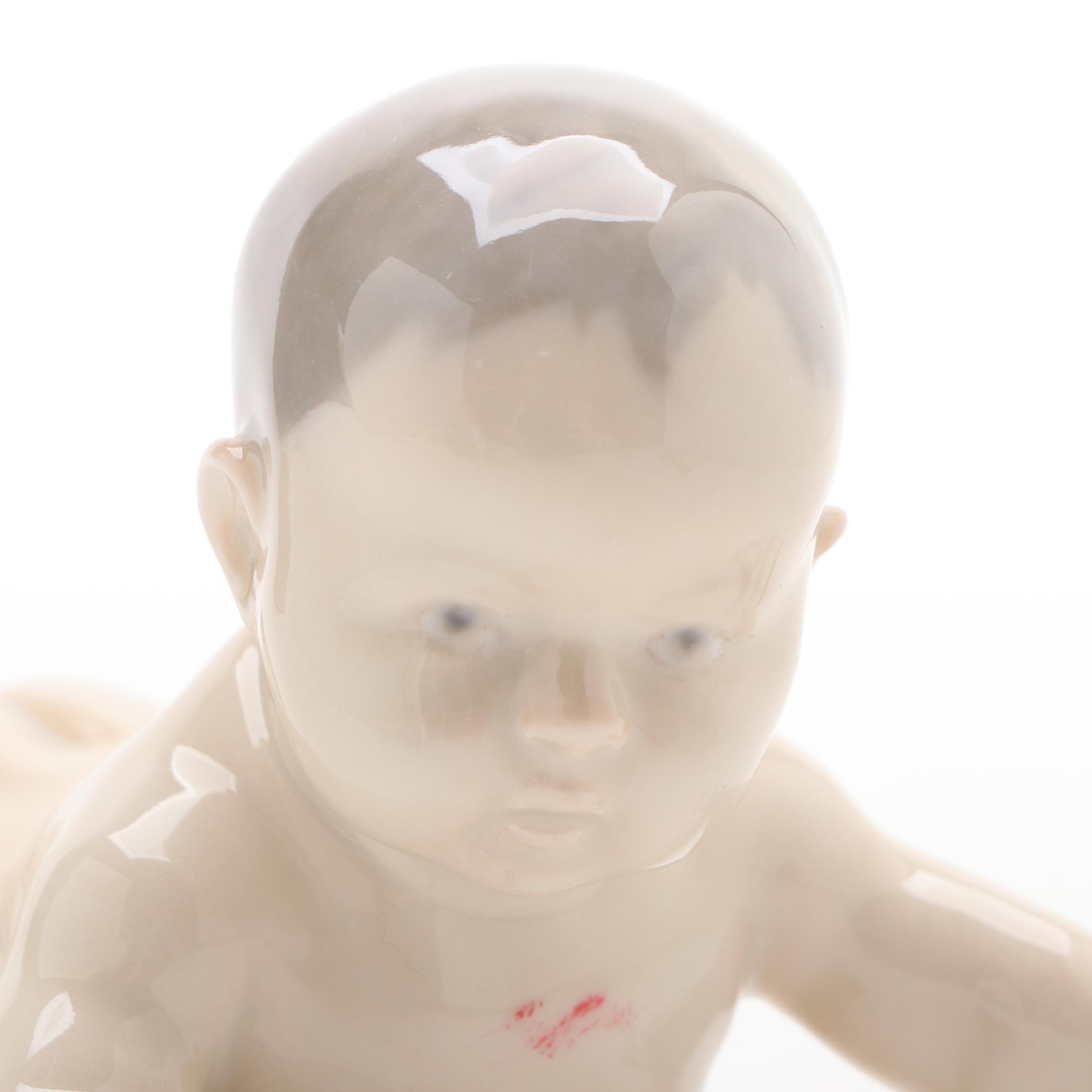 Royal Copenhagen "Baby Crawling" and "Baby Pointing" Porcelain Figurines