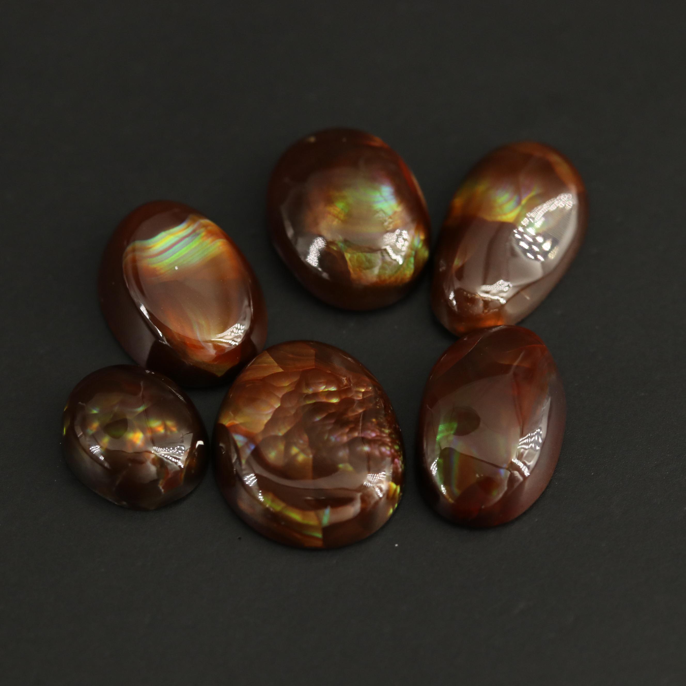 Loose Fire Agate Selection Featuring Oval Cabochon Shapes