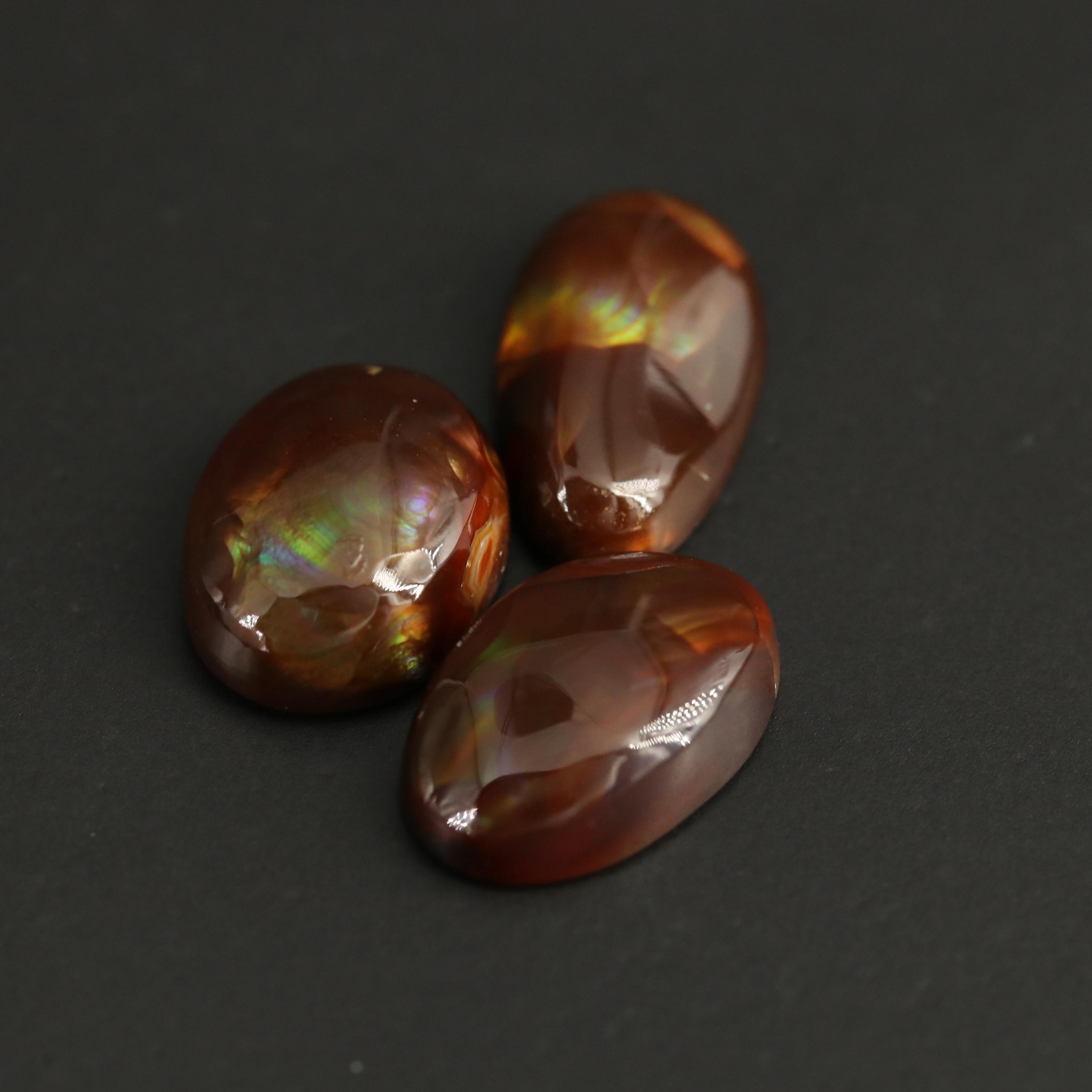 Loose Fire Agate Selection Featuring Oval Cabochon Shapes