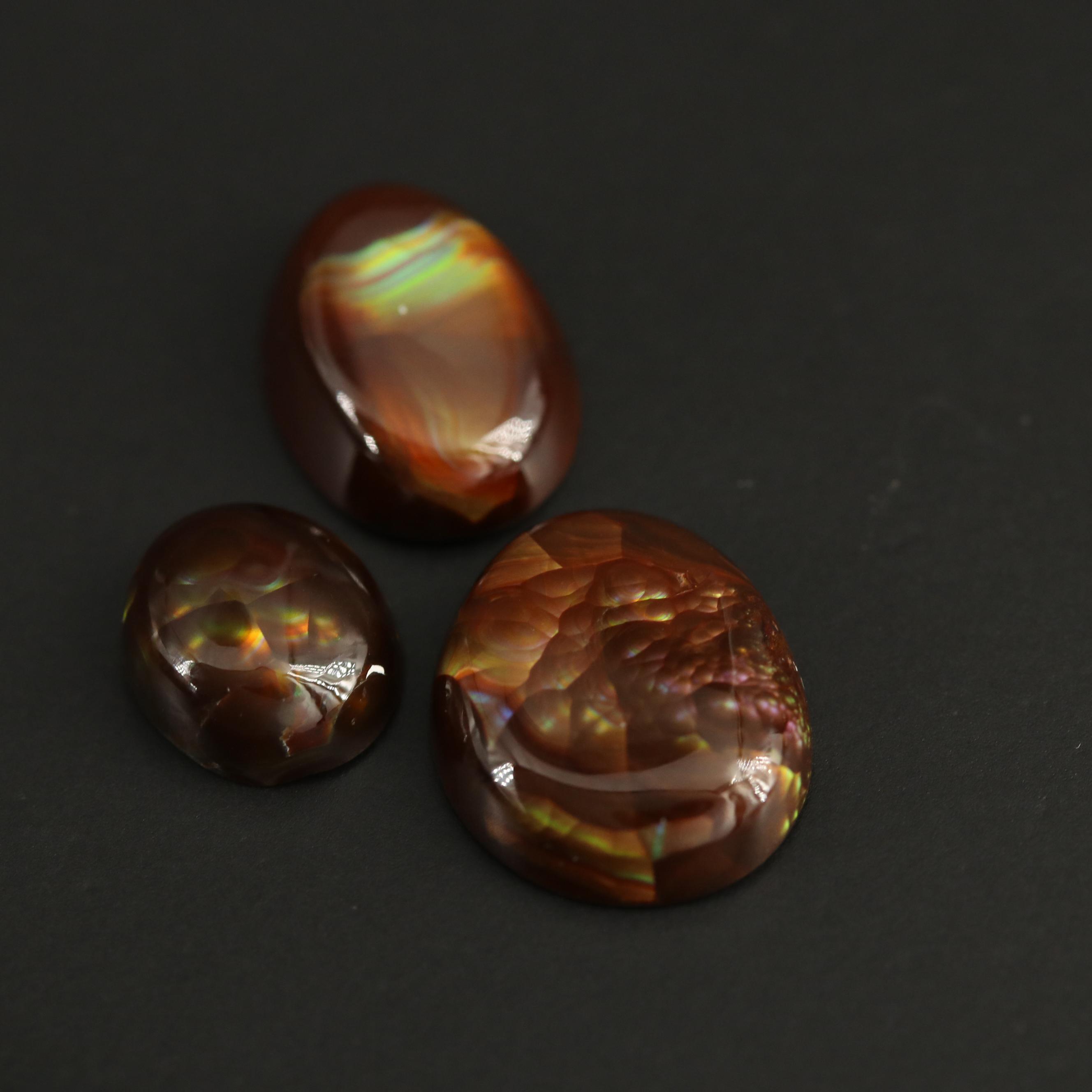 Loose Fire Agate Selection Featuring Oval Cabochon Shapes