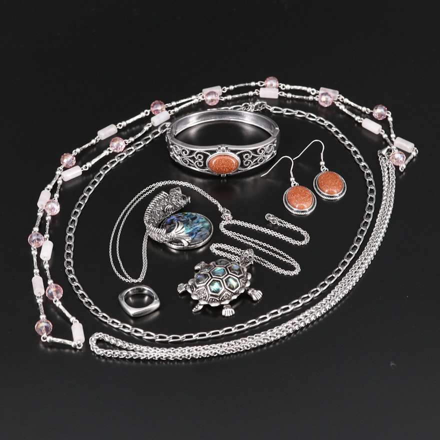 Selection of Jewelry Featuring Necklaces, Cuff, Ring and Earrings