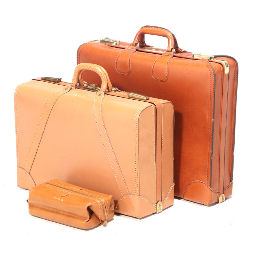 Two Cowhide Suitcases Plus Dop Kit, Monogrammed "H.E.S."