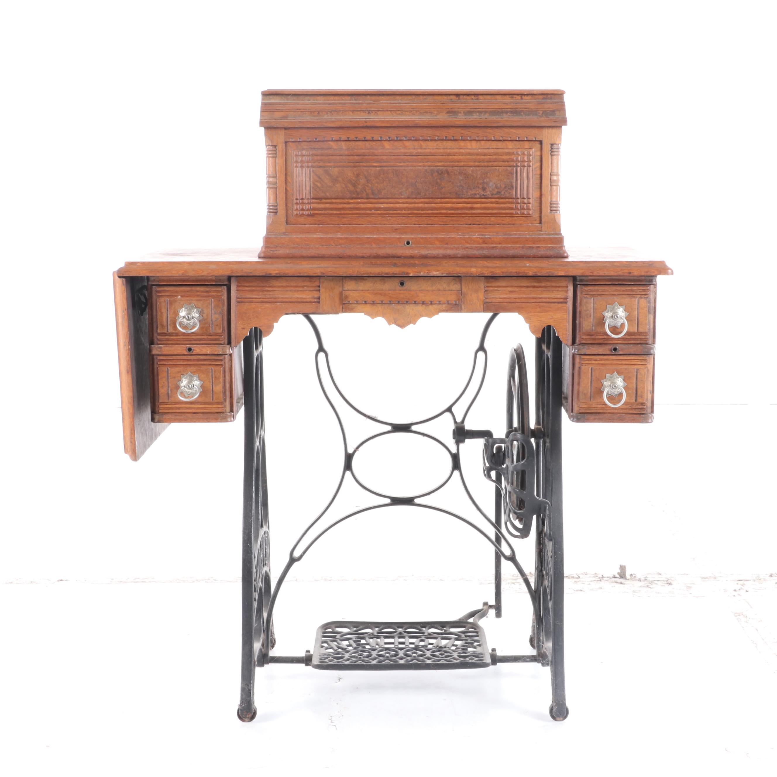 New Home Treadle Sewing Machine and Oak Sewing Table, circa 1890