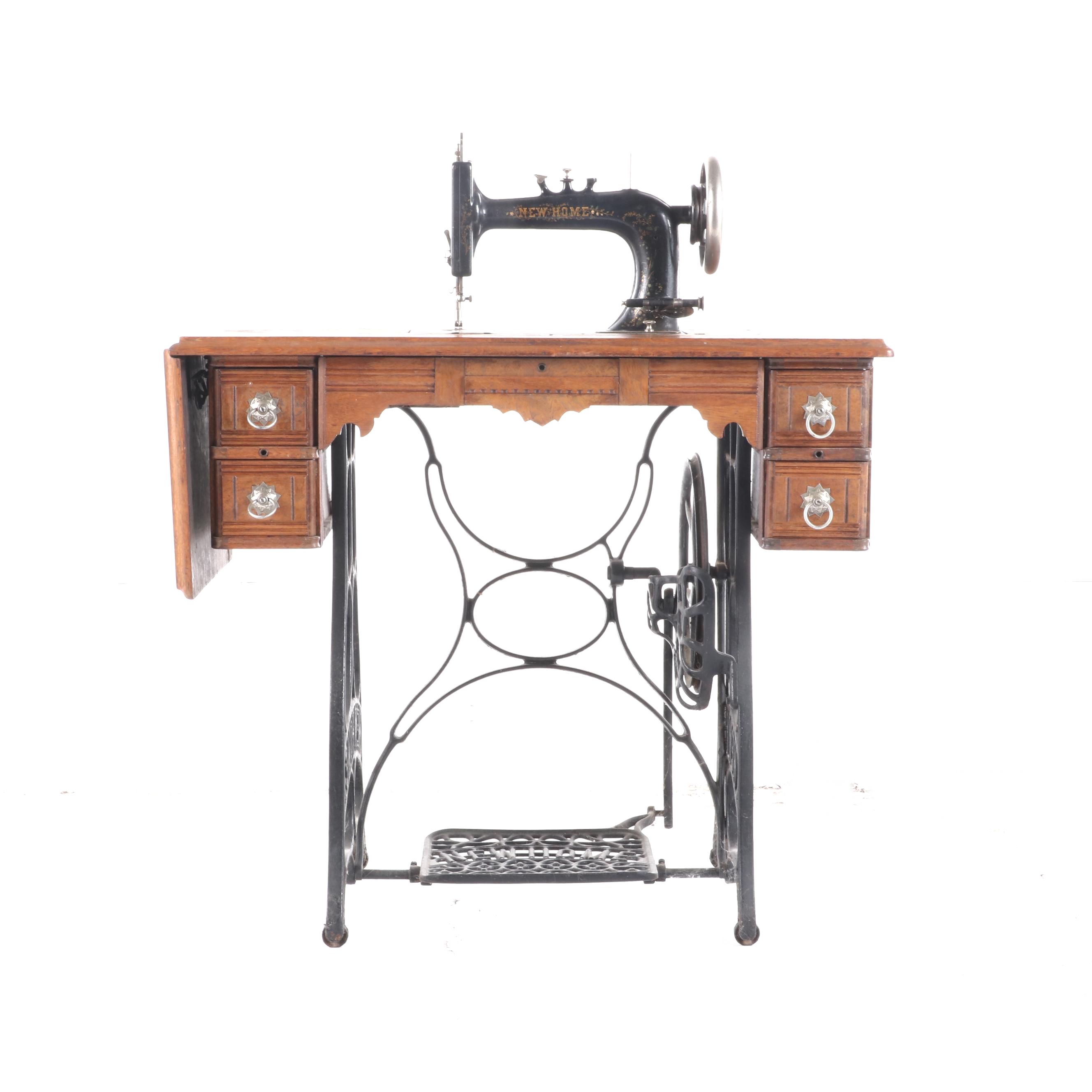 New Home Treadle Sewing Machine and Oak Sewing Table, circa 1890