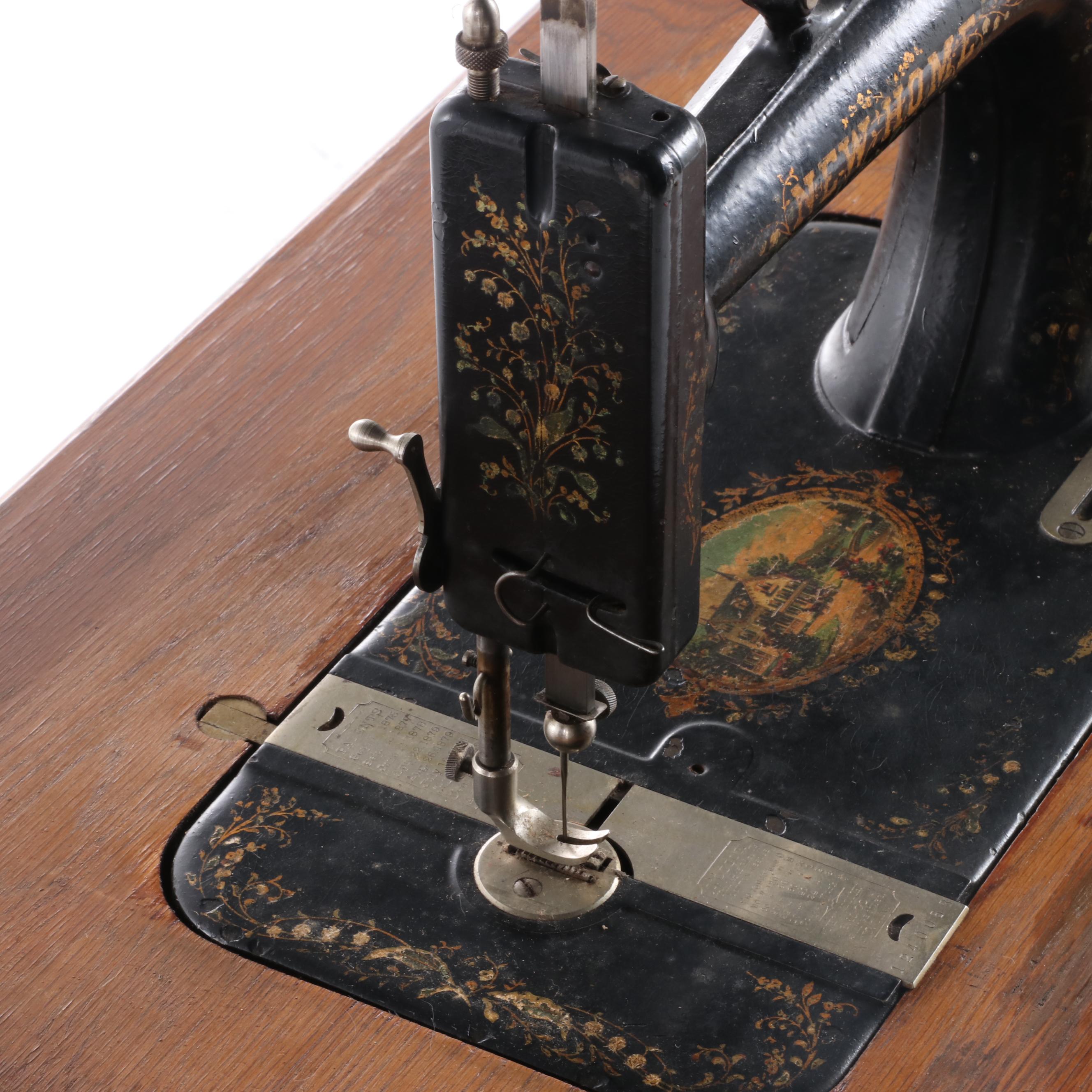 New Home Treadle Sewing Machine and Oak Sewing Table, circa 1890