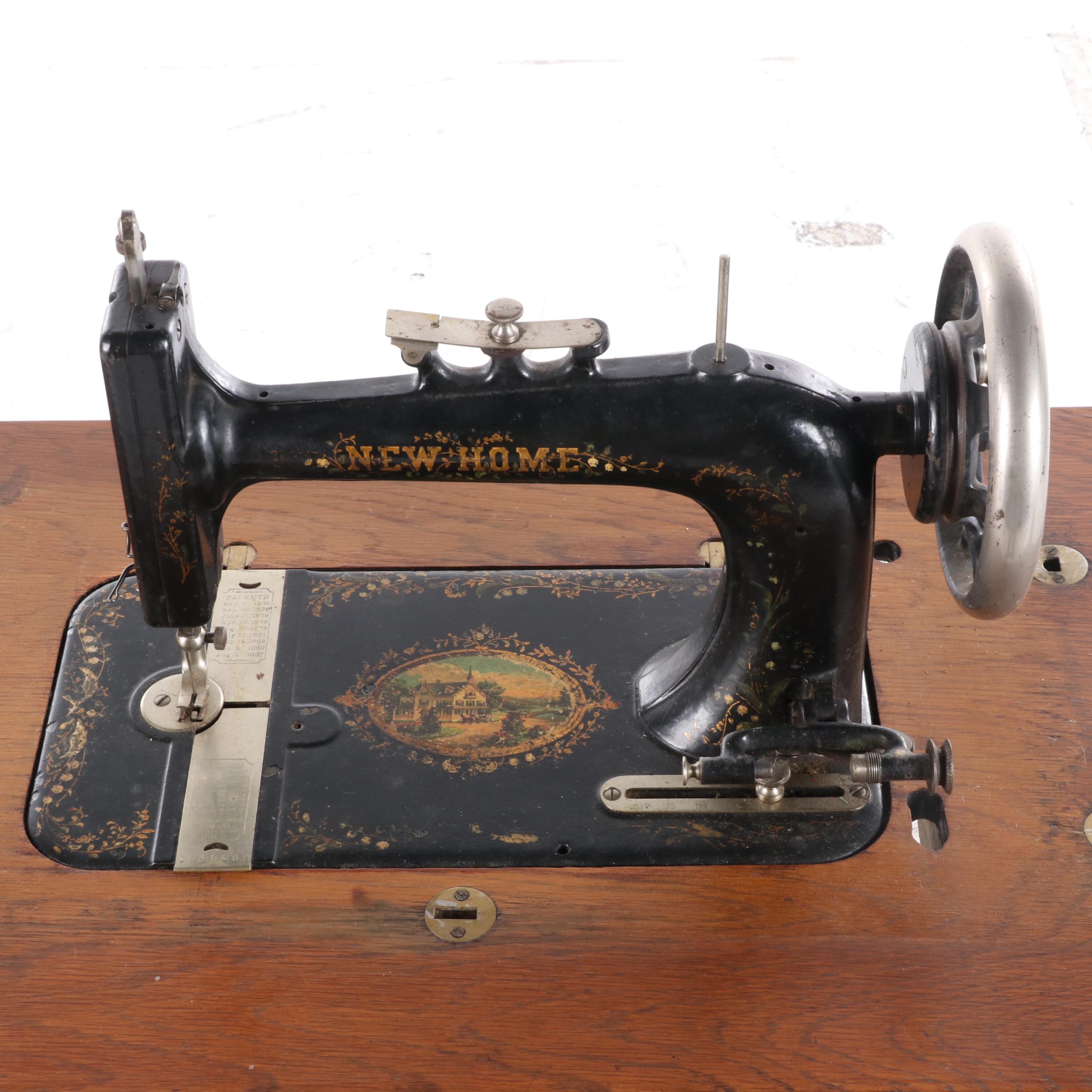 New Home Treadle Sewing Machine and Oak Sewing Table, circa 1890
