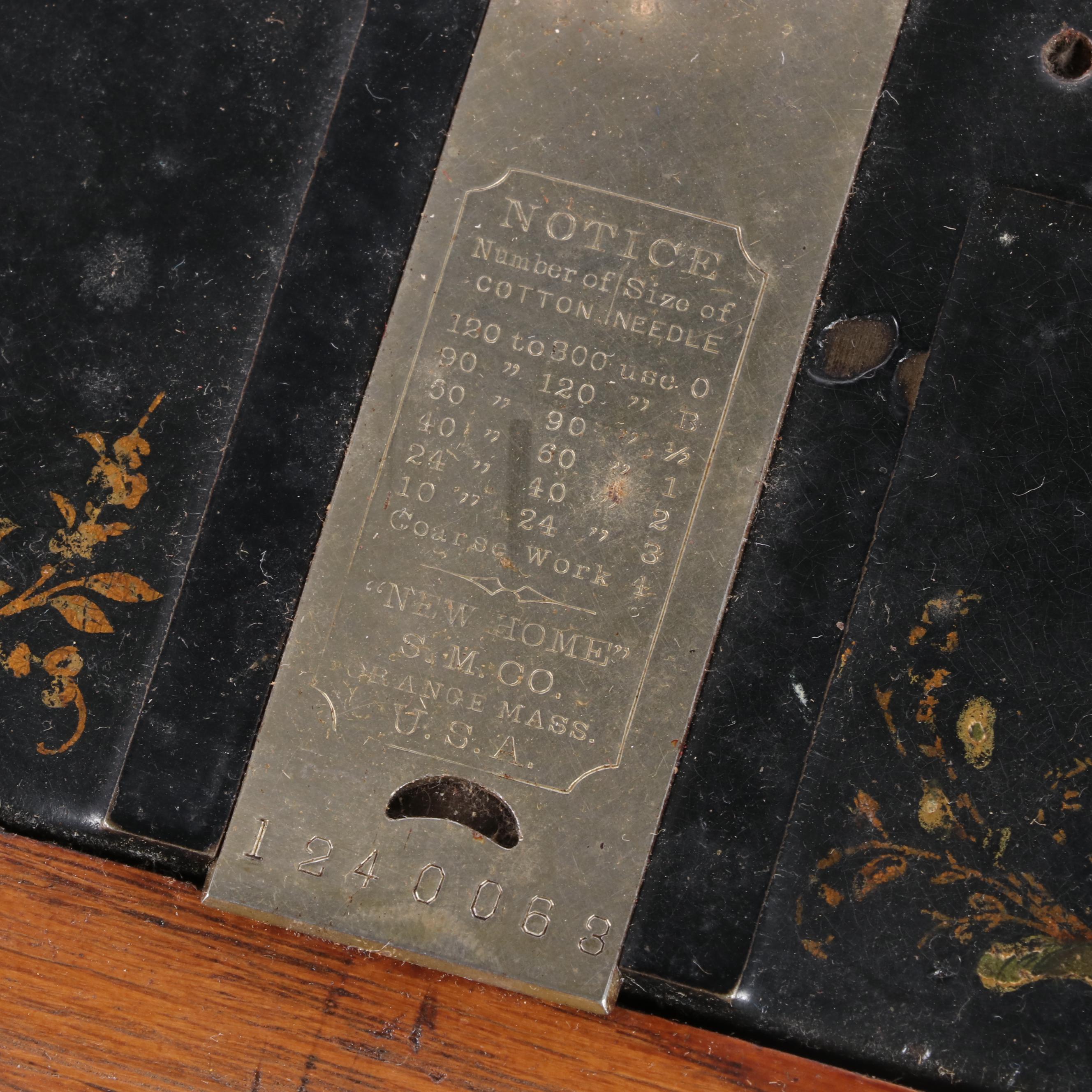 New Home Treadle Sewing Machine and Oak Sewing Table, circa 1890