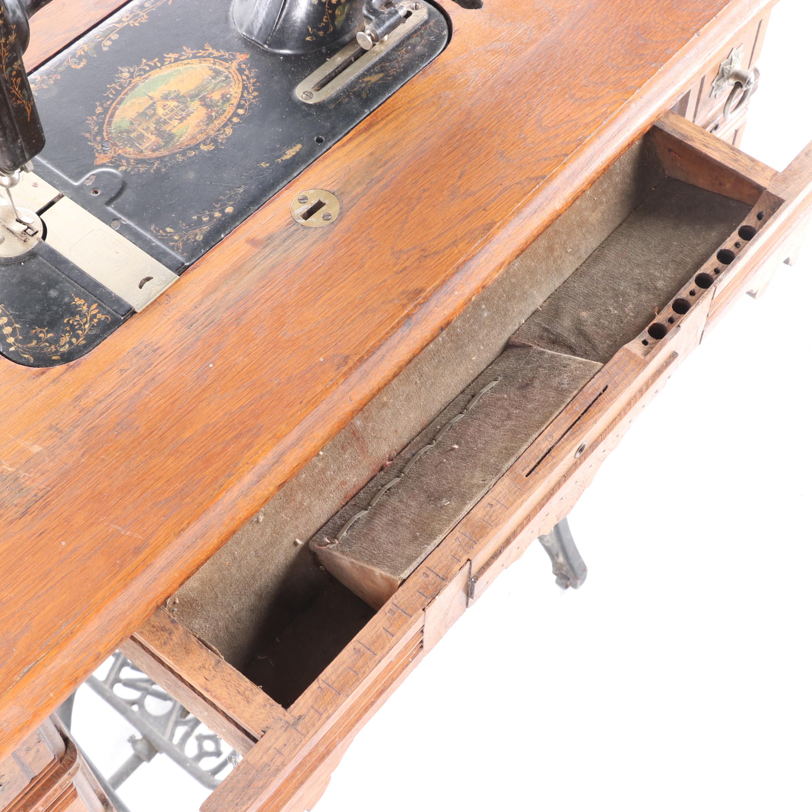 New Home Treadle Sewing Machine and Oak Sewing Table, circa 1890
