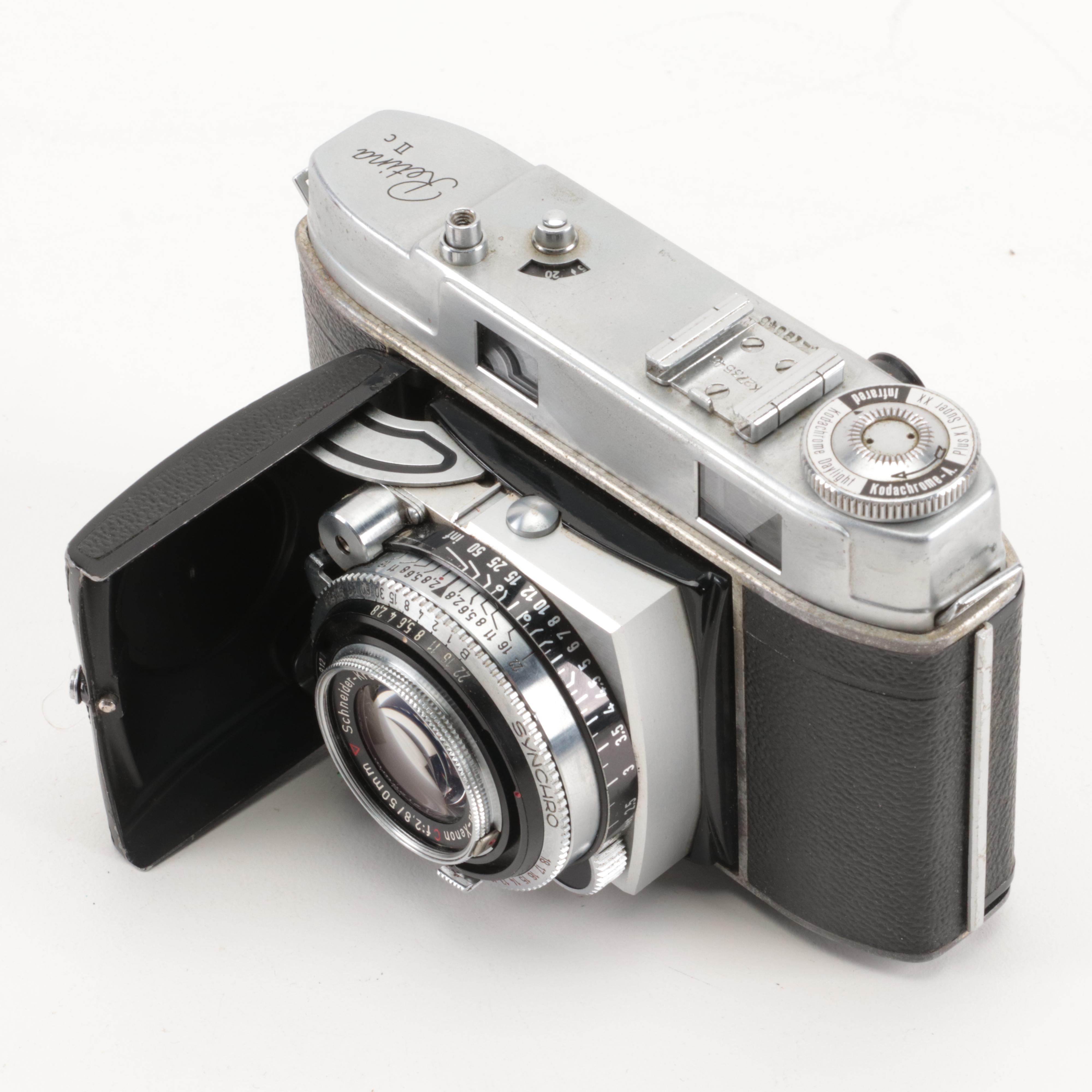 Collection of Kodak Retina Reflex Cameras With Leather Cases