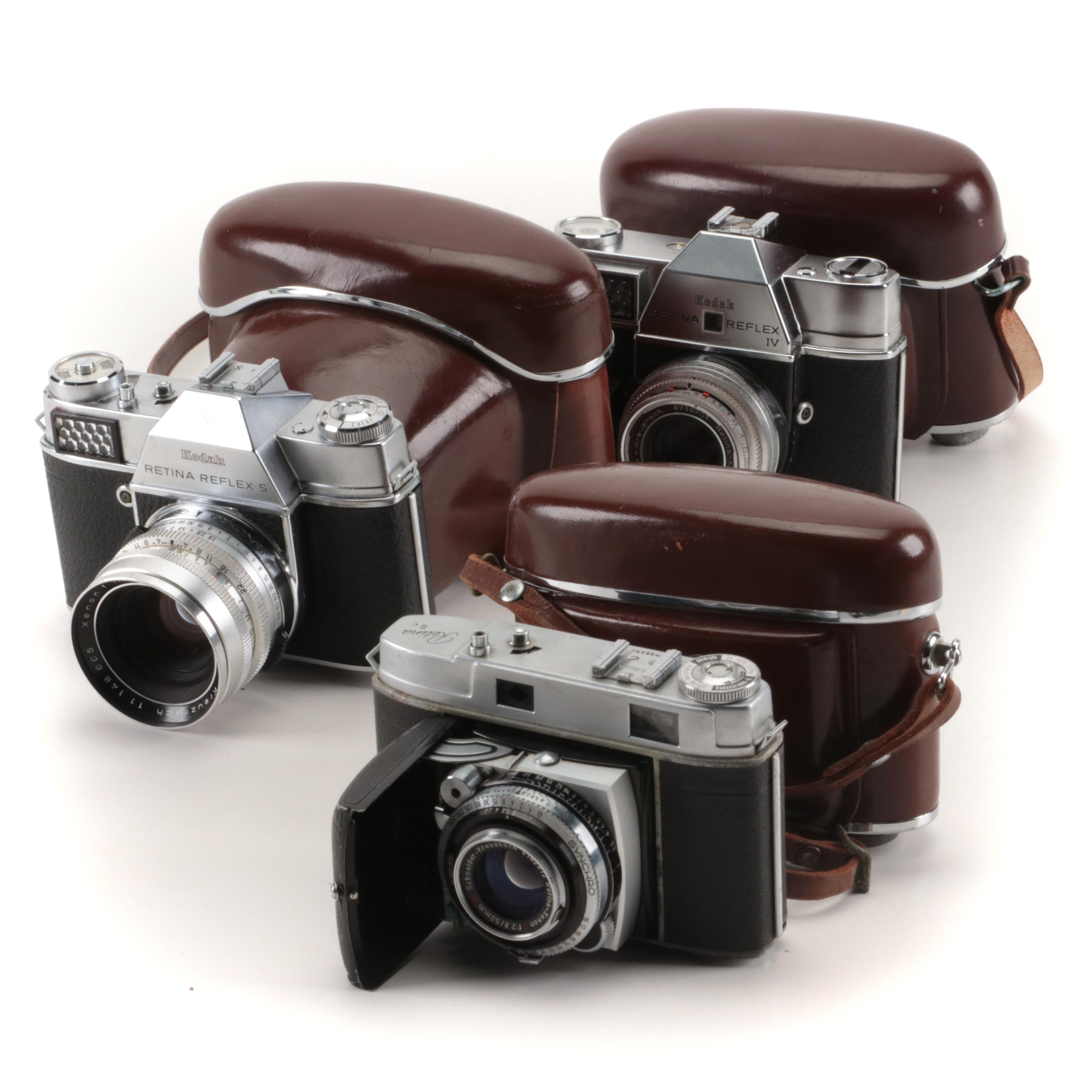 Collection of Kodak Retina Reflex Cameras With Leather Cases