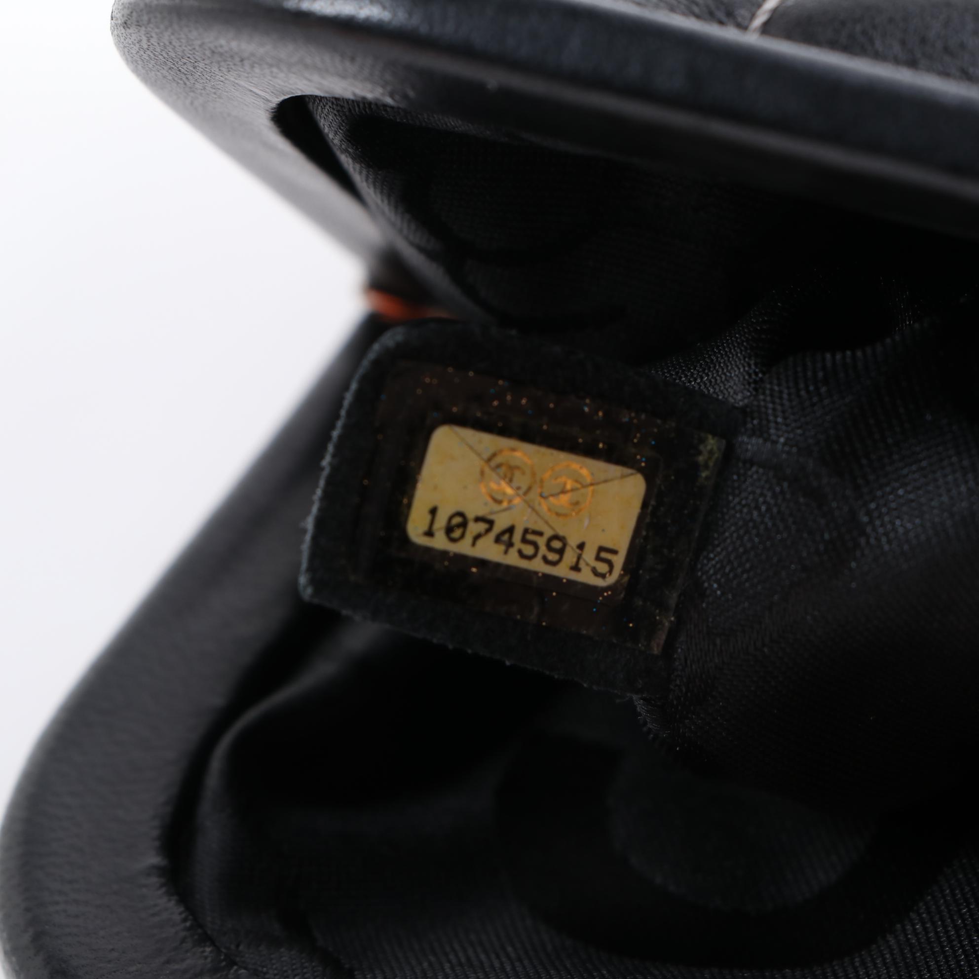 Chanel Mademoiselle Vertical Quilted Black Lambskin Clutch