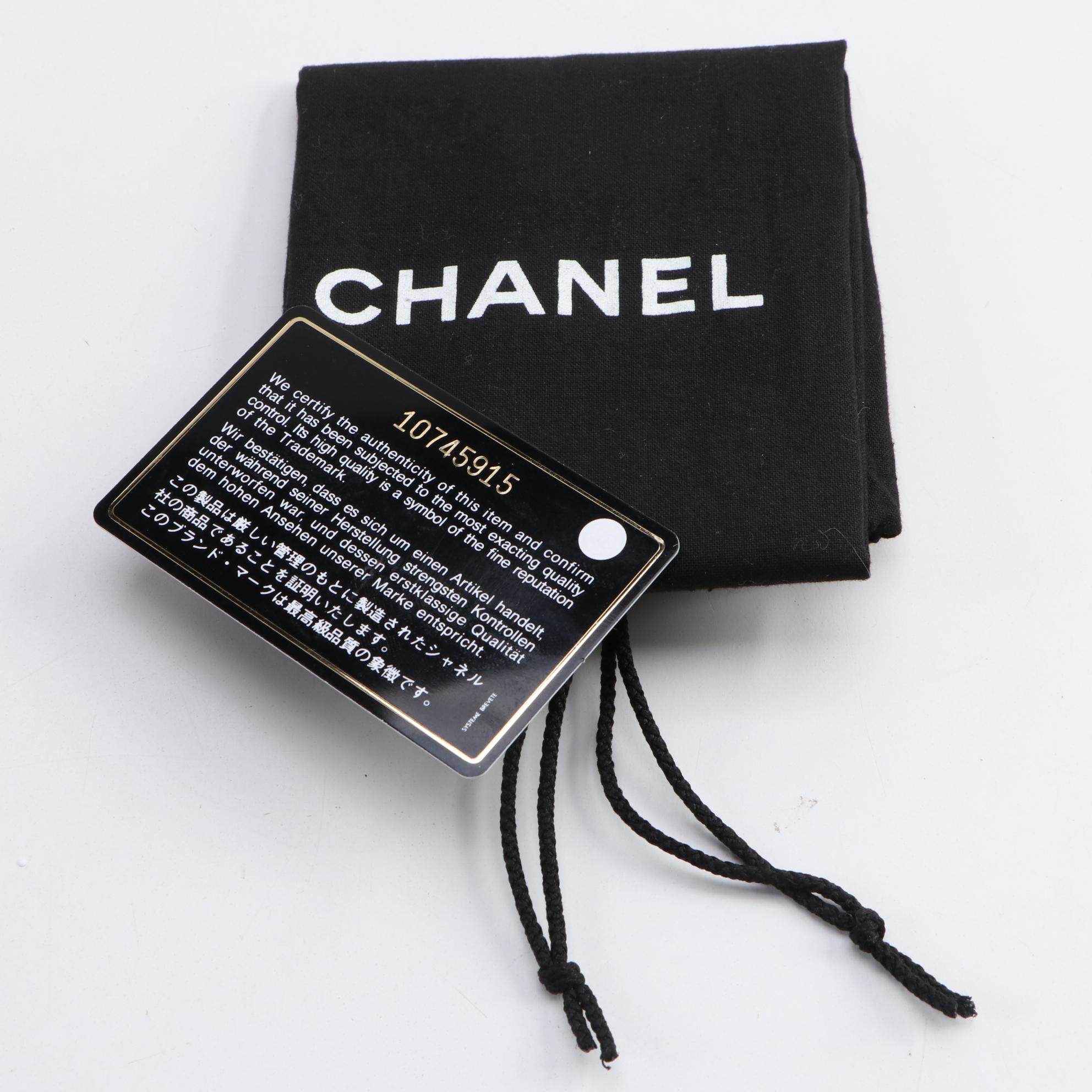 Chanel Mademoiselle Vertical Quilted Black Lambskin Clutch