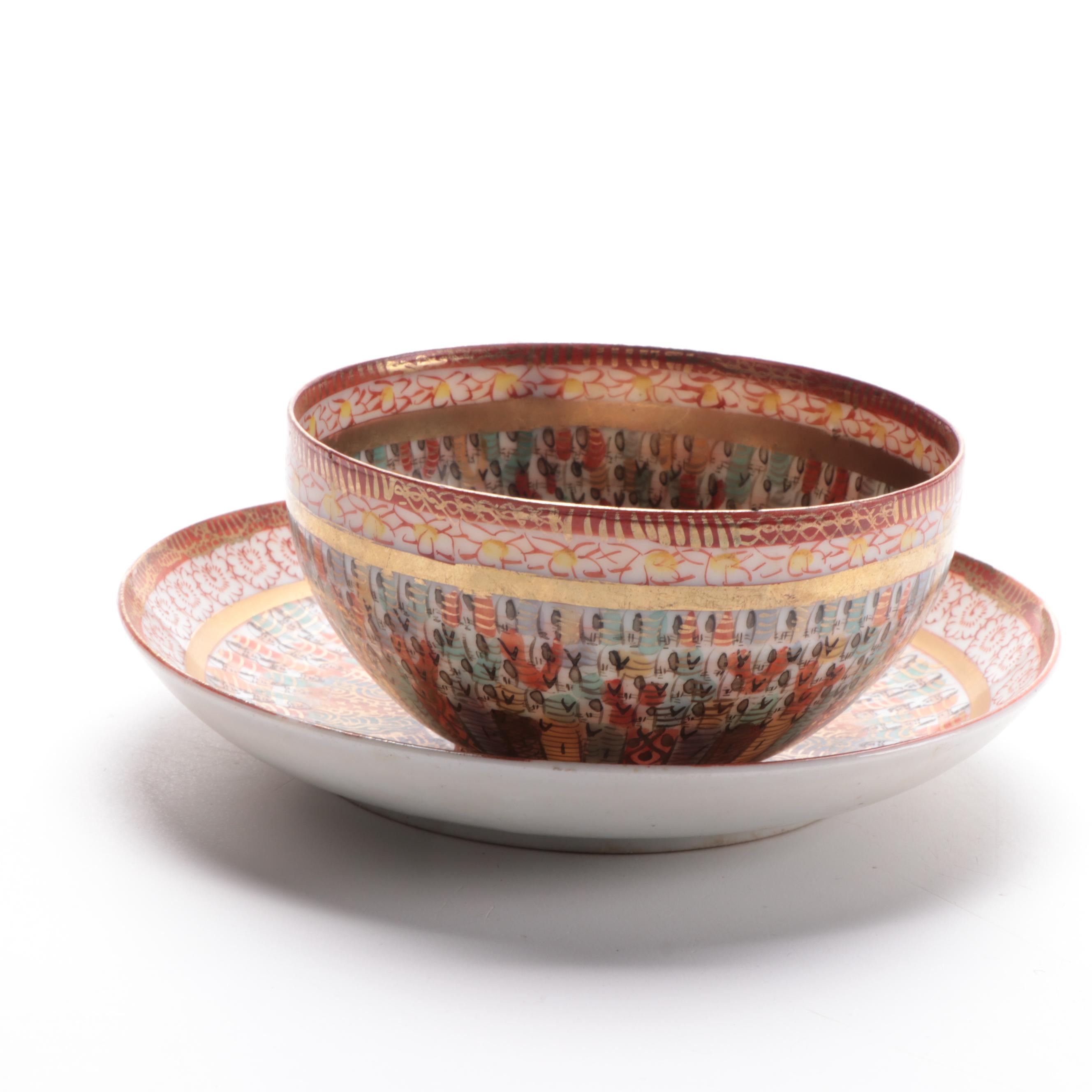 Japanese Kutani Ware "Thousand Faces" Porcelain Teacup and Saucer