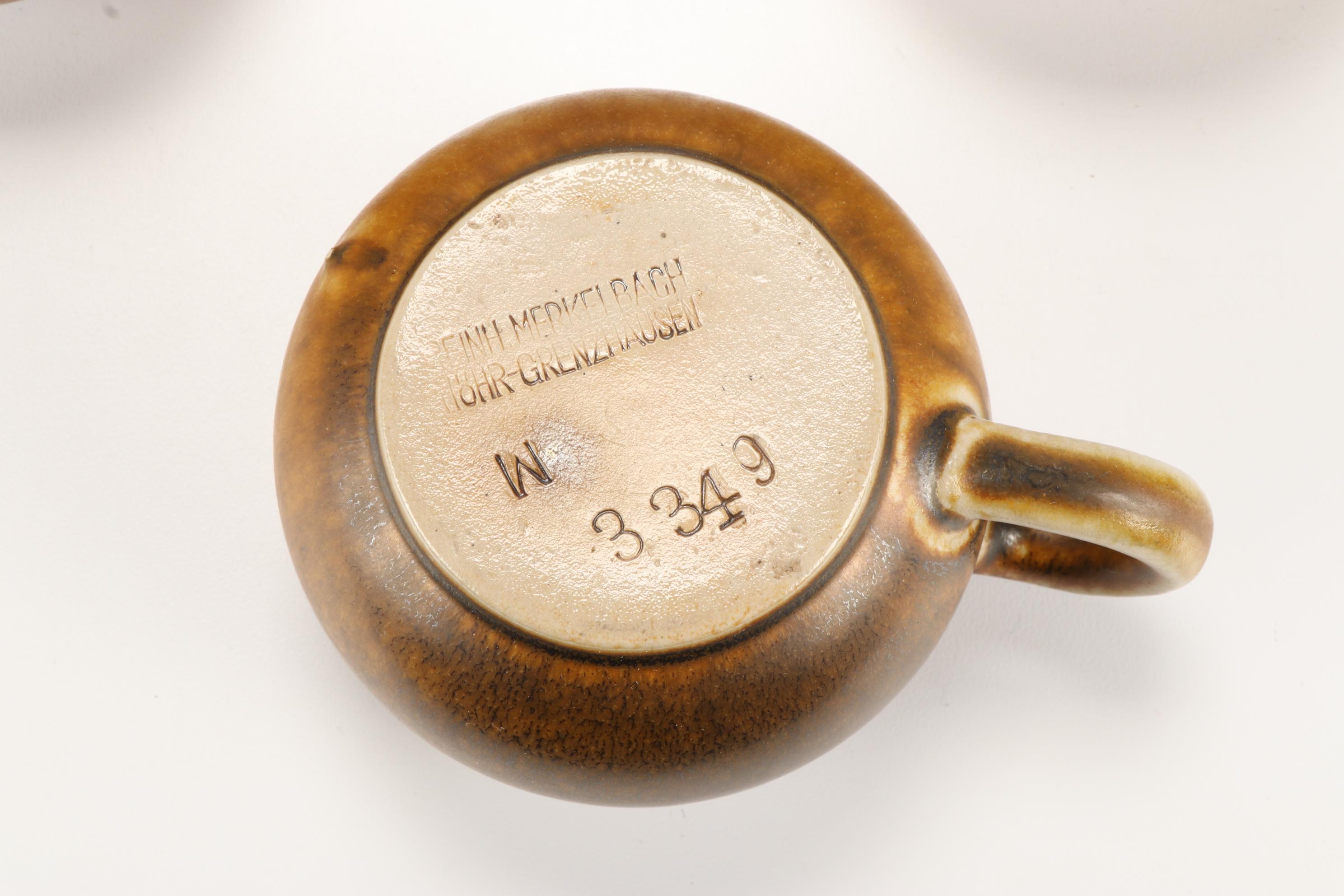 German Reinhold Merkelbach Stoneware Mugs and Hand Carved Wooden Figurines