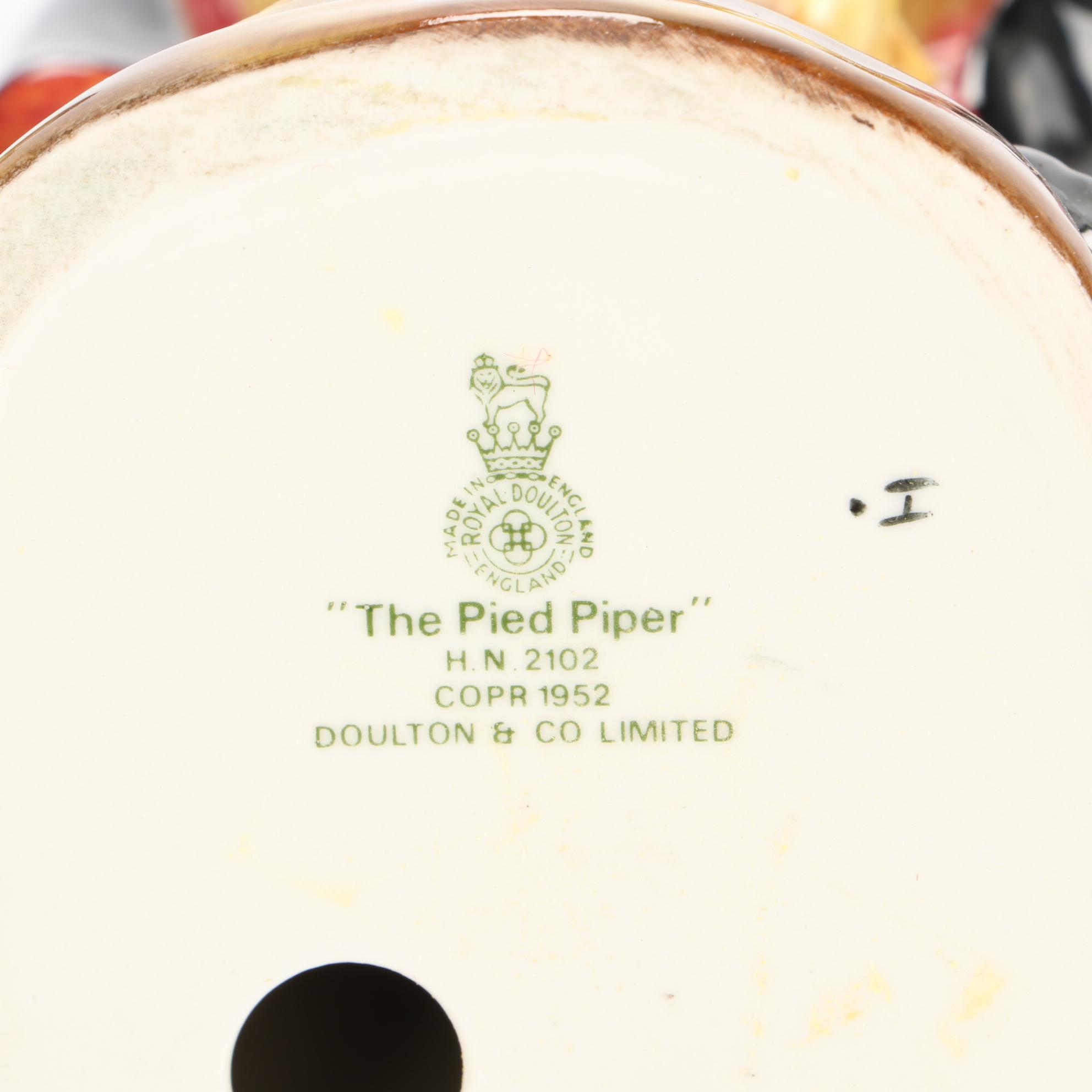 Royal Doulton "The Mask Seller" and "The Pied Piper" Earthenware Figurines