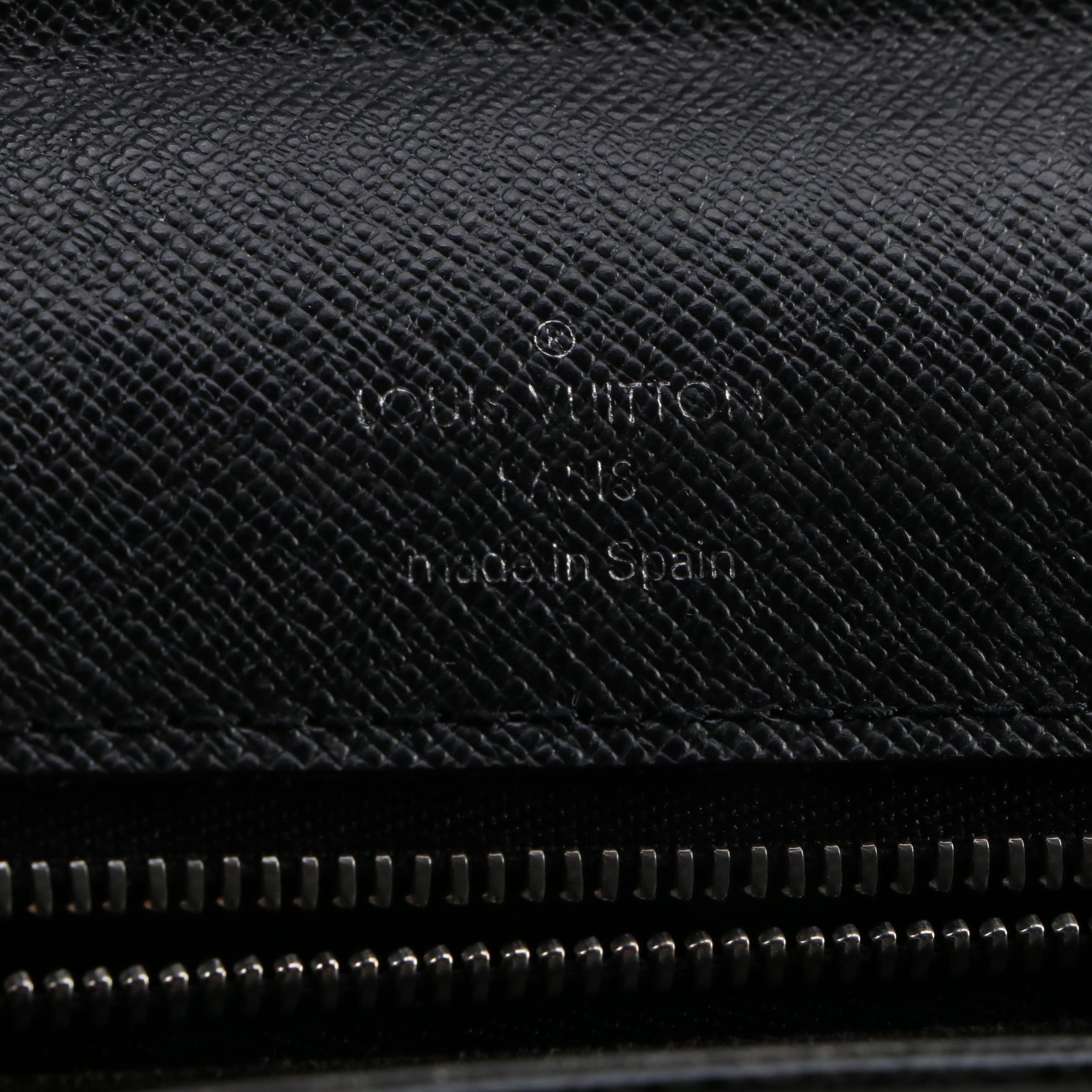 Louis Vuitton Pochette Selenga Clutch Wristlet in Black Taiga Leather