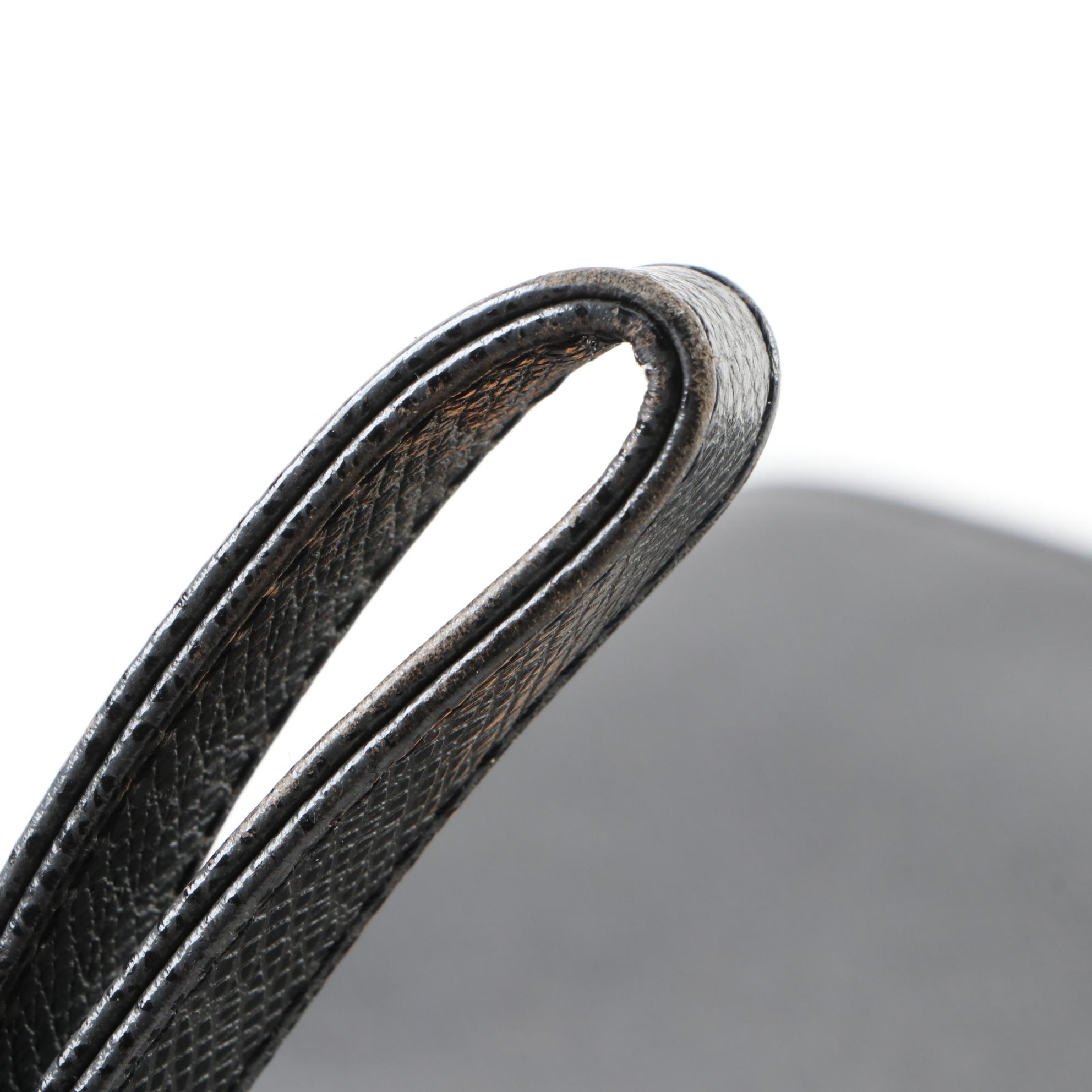 Louis Vuitton Pochette Selenga Clutch Wristlet in Black Taiga Leather