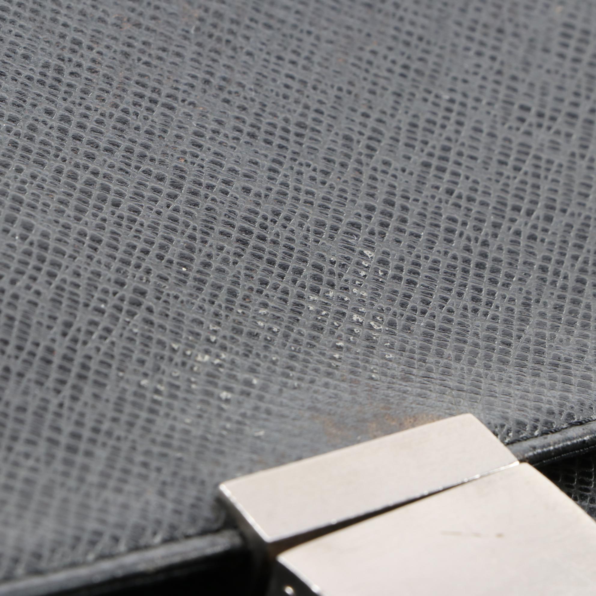 Louis Vuitton Pochette Selenga Clutch Wristlet in Black Taiga Leather