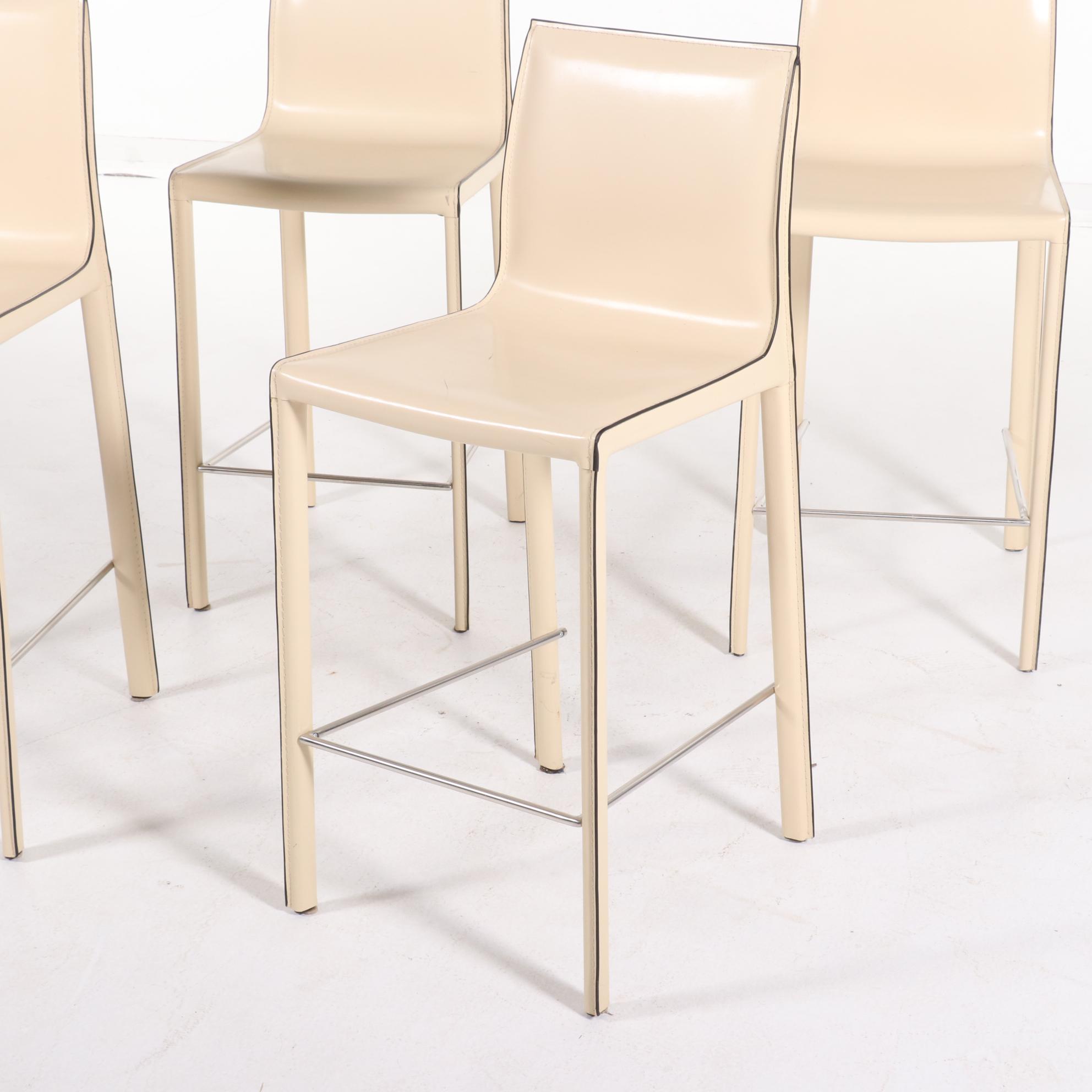 Four Modernist Style Cream Faux Leather Wrapped Counter Stools