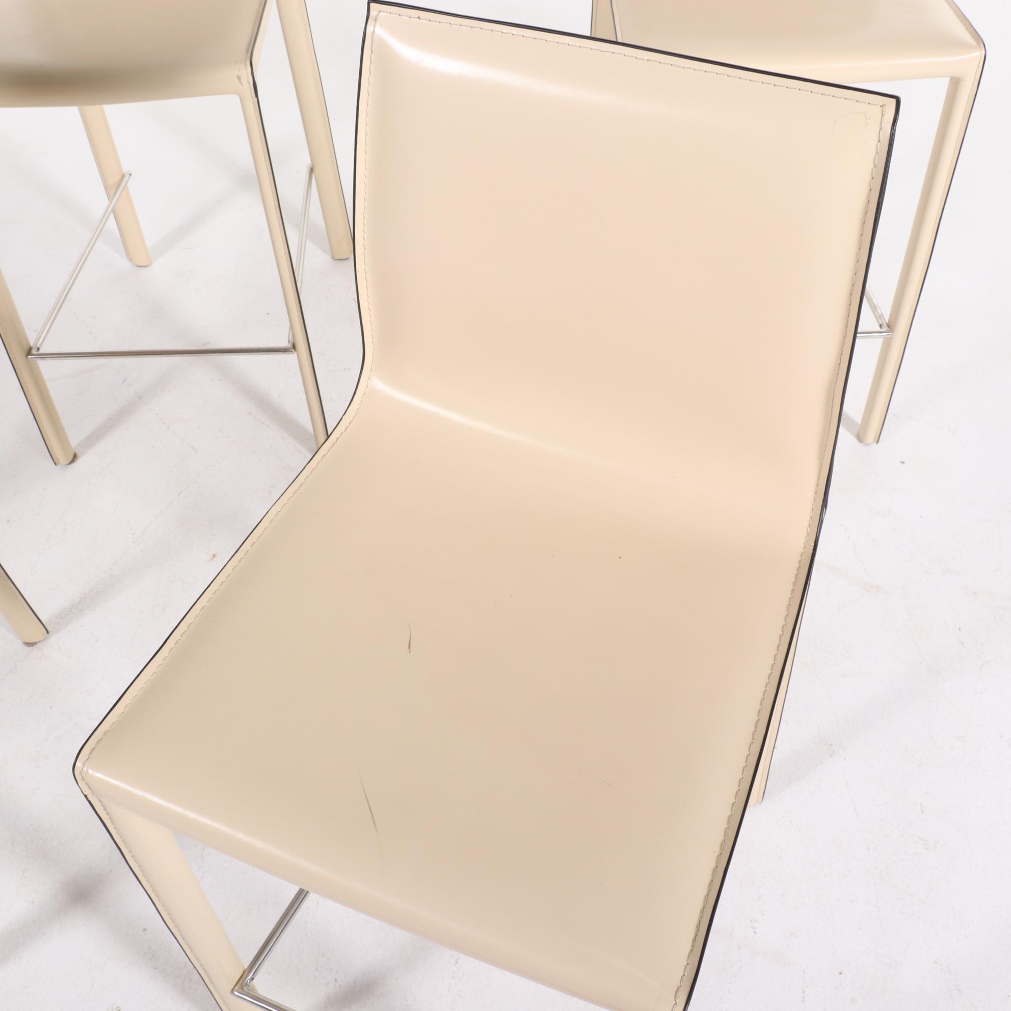 Four Modernist Style Cream Faux Leather Wrapped Counter Stools