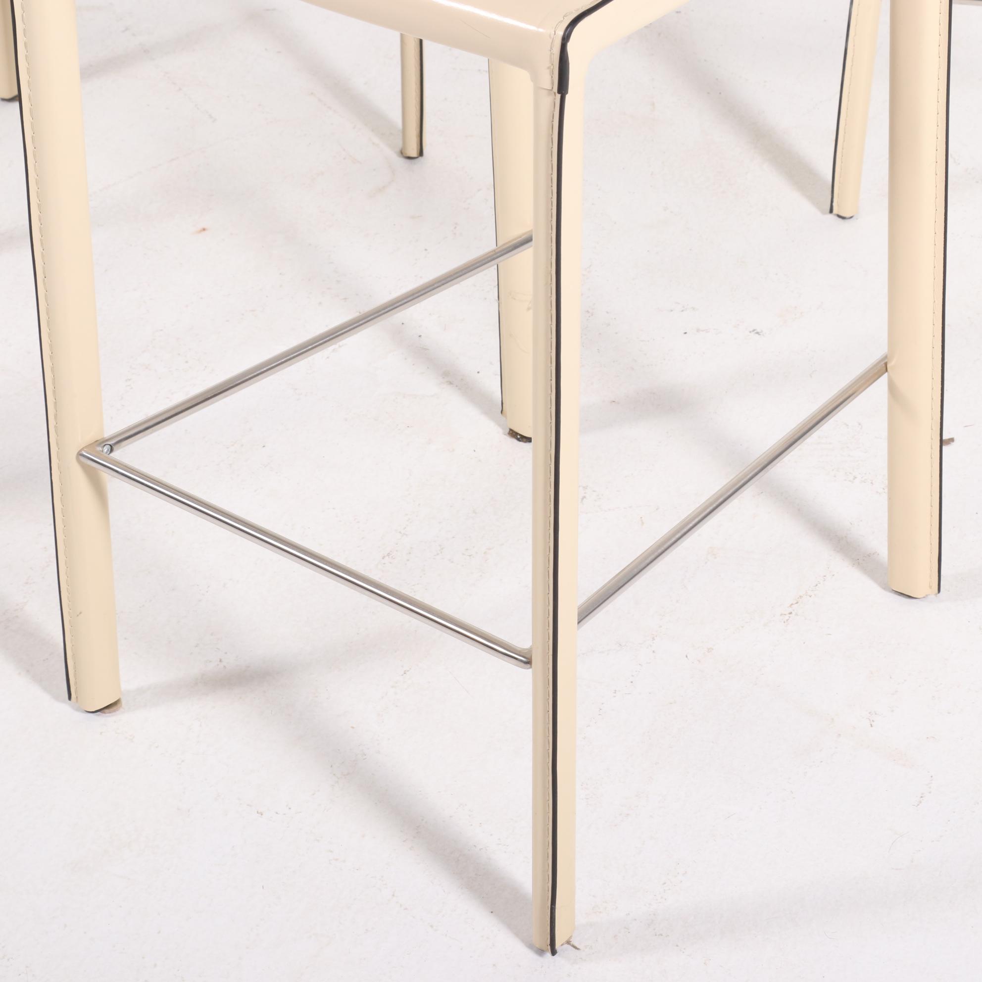 Four Modernist Style Cream Faux Leather Wrapped Counter Stools
