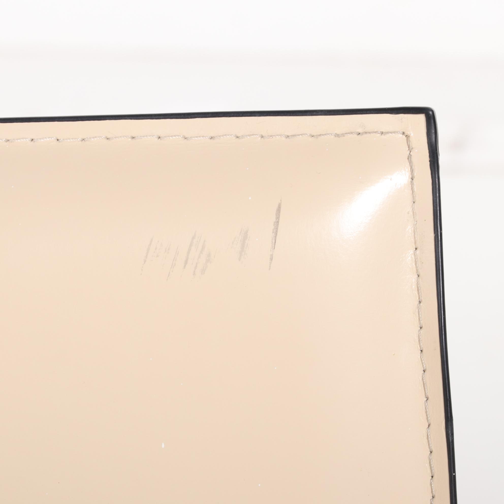 Four Modernist Style Cream Faux Leather Wrapped Counter Stools