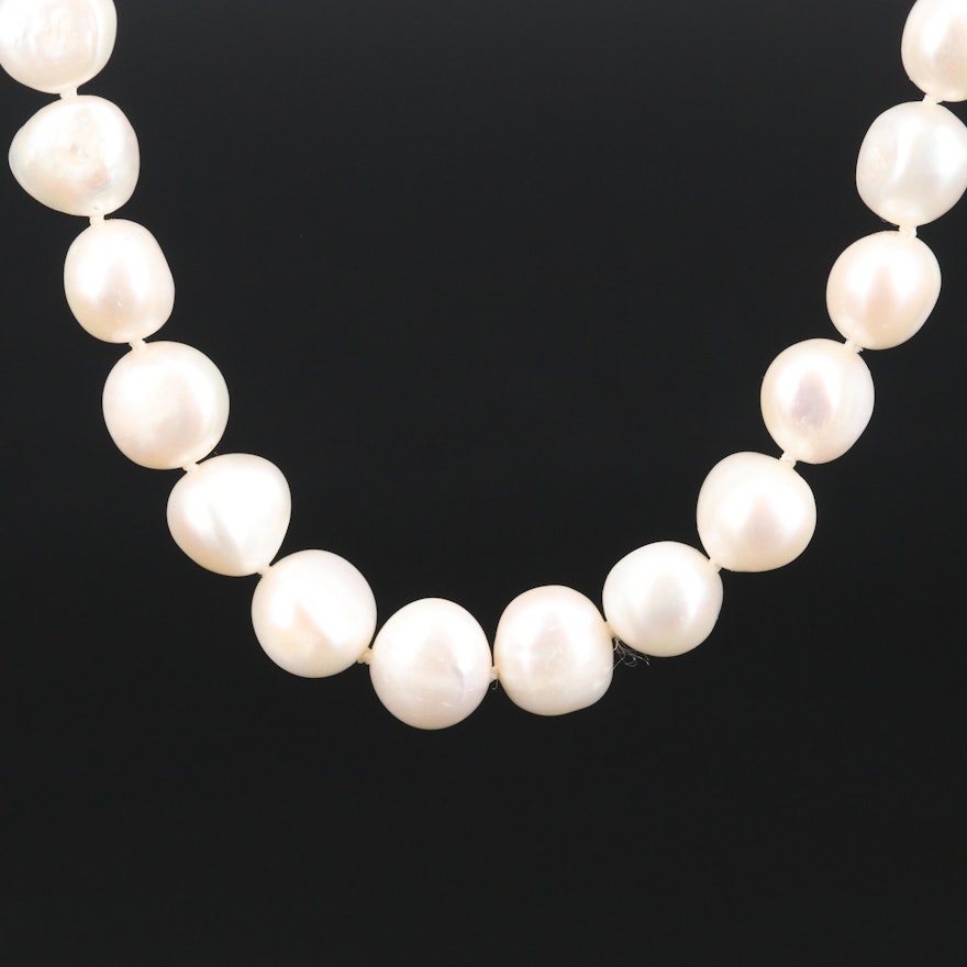 Strand of Semi-Baroque Pearls with 14K Clasp