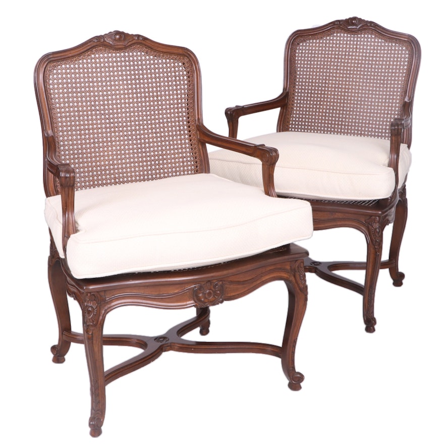 Pair of Louis XV Style Carved Fruitwood and Caned Fauteuils