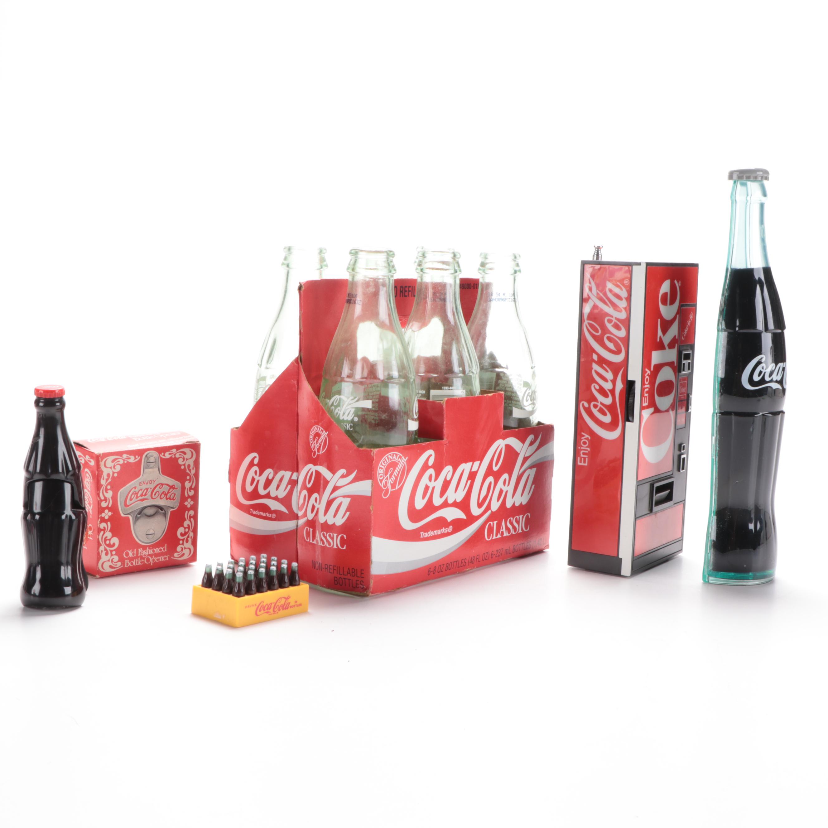 Coca-Cola Advertising Items Including 8oz Bottles, Radio, Stapler, and More