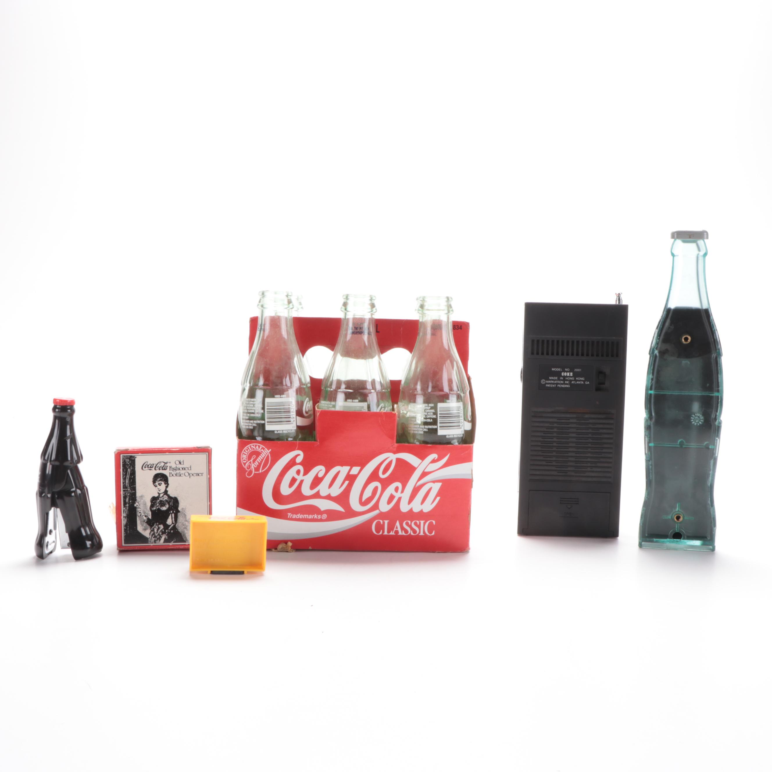 Coca-Cola Advertising Items Including 8oz Bottles, Radio, Stapler, and More