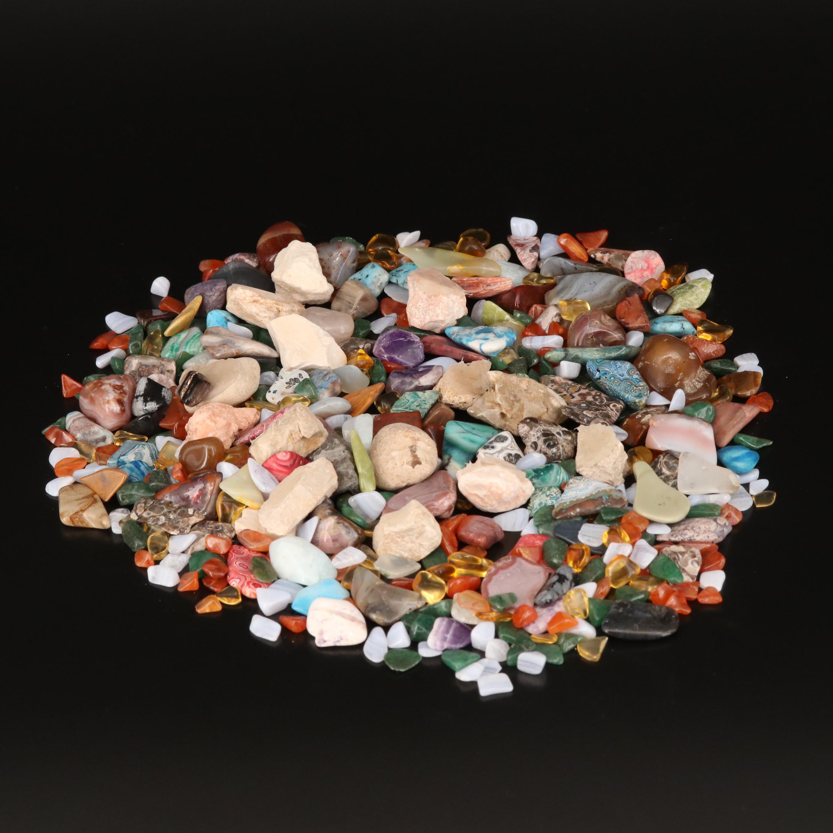 Polished and Rough Gemstones Including Tiger's Eye, Turquoise, Jasper, and More