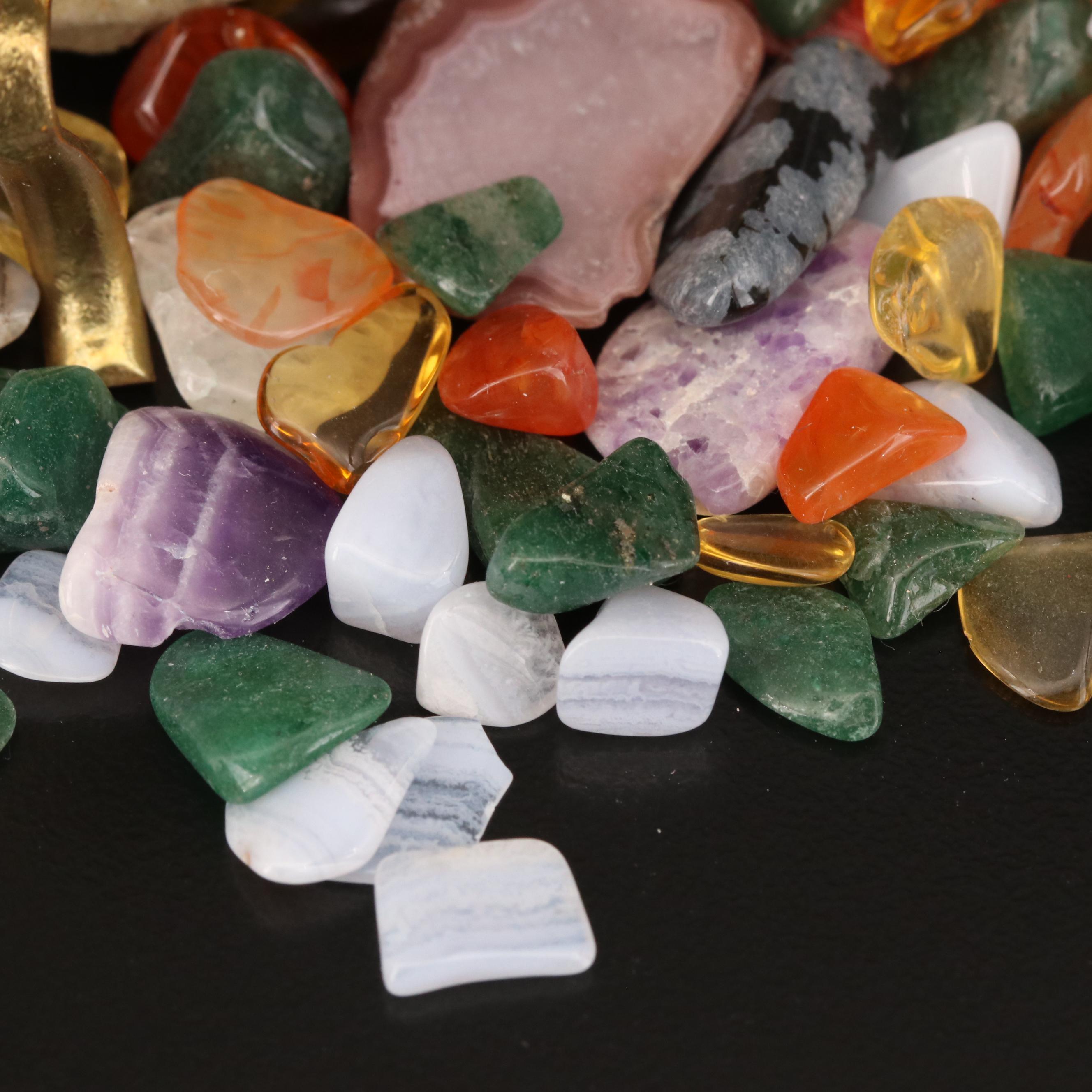 Polished and Rough Gemstones Including Tiger's Eye, Turquoise, Jasper, and More