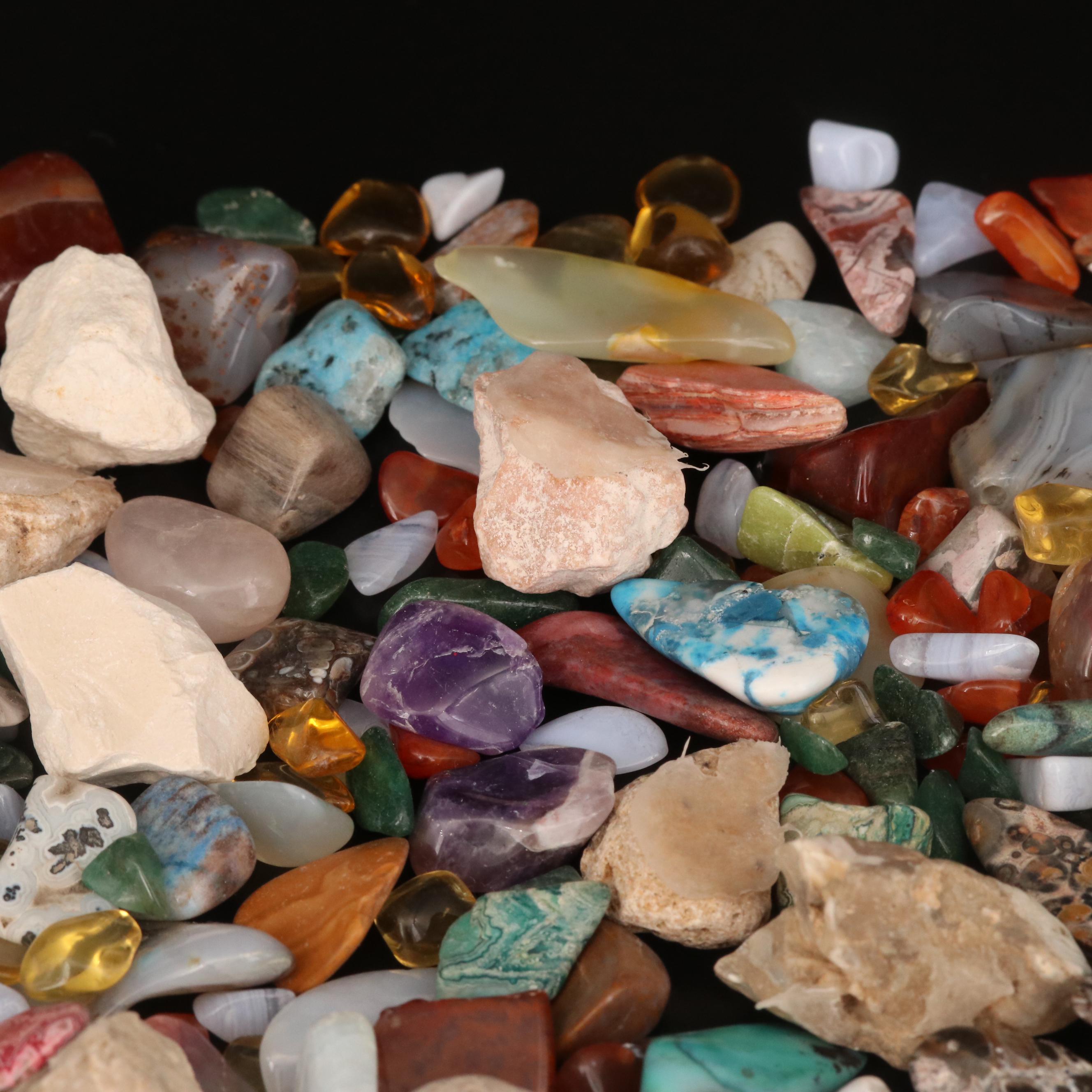 Polished and Rough Gemstones Including Tiger's Eye, Turquoise, Jasper, and More