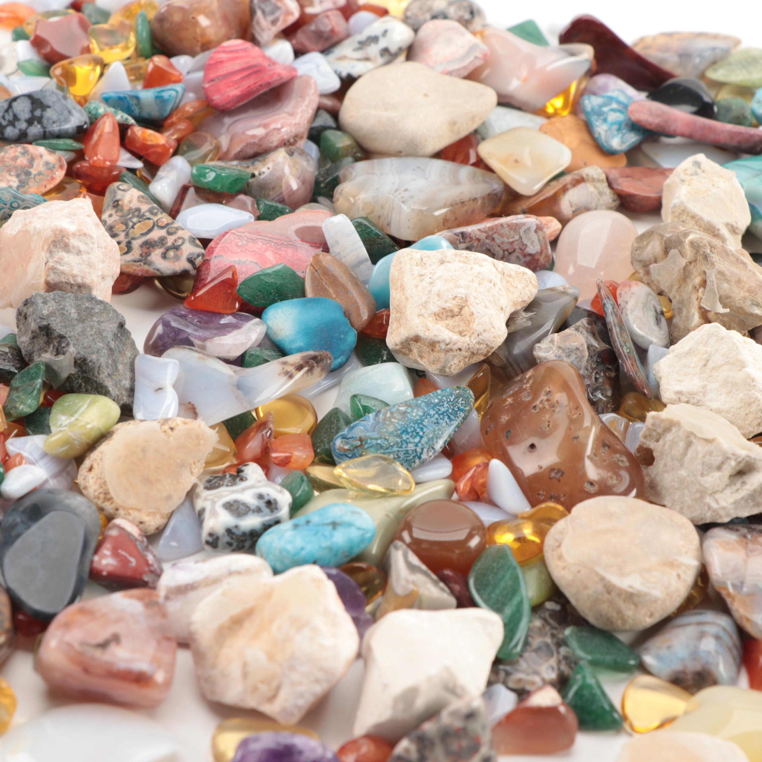 Polished and Rough Gemstones Including Tiger's Eye, Turquoise, Jasper, and More